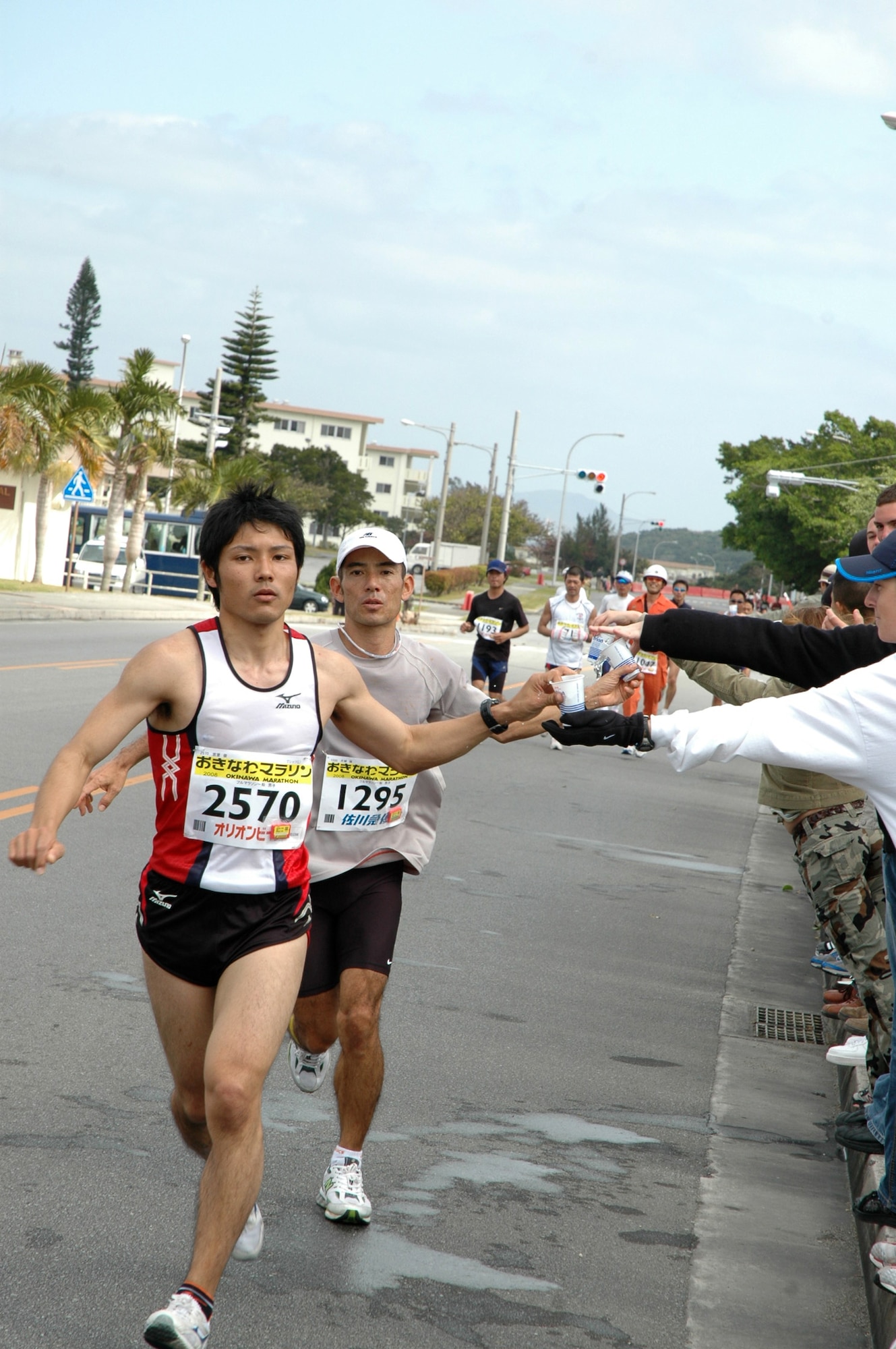 Competitors run the second half of the 16th Okinawa Marathon at Kadena.  Airmen and family members cheered and handed out water during the marathon.
More than 9,300 Okinawan and Japanese runners participated in the marathon. These runners are just passing the 30-kilometer point. (U.S. Air Force photo/Capt. Jon Quinlan)
