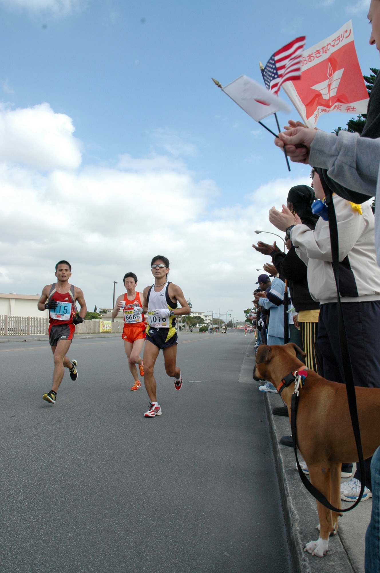 Competitors run the second half of the 16th  Okinawa Marathon at Kadena Air Base Feb. 23. Airmen and family members cheered and handed out water during the marathon which ran through the base. More than 9,300  Japanese and Americans ran in the annual race making it the biggest on Okinawa. (U.S. Air Force photo/Capt. Jon Quinlan)