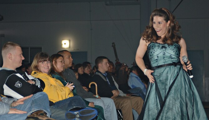 First Lieutenant Kimberly Robinson sings and dances for the crowd during a Tops in Blue performance on Dec. 29, 2007, at Misawa Air Base, Japan. Tops in Blue is on tour performing "The Fly-By", a musical tribute to 60 years of proud Air Force History.  (U.S. Air Force photo by Airman 1st Class Benjamin Wilson)