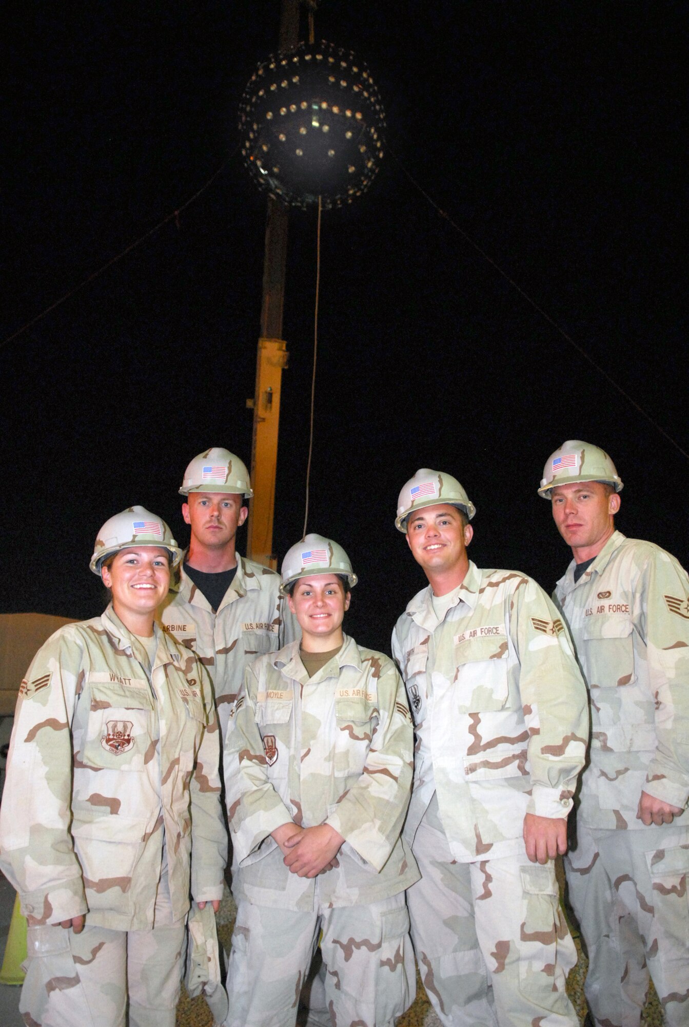 SOUTHWEST ASIA - Left to right: Senior Airman Melanie Wyatt, Staff Sgt. Brian Barbine, Senior Airman Tina McIimoyle, Senior Airman Monty Smith and Staff Sgt. Michael Shannon, all with the 379th Expeditionary Civil Engineer Squadron, stand in front of the huge lighted ball they built in less than 72 hours to help U.S. and coalition forces here ring in the New Year. (U.S. Air Force photo/Staff Sgt. Doug Olsen)
The engineers assembled the lighted ball to use during a New Year's Eve celebration. The ball will be lowered by a crane at midnight.  (United States Air Force photo by Staff Sgt. Douglas Olsen)