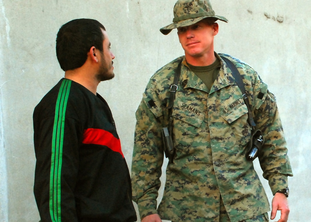 Afghan National Army Sgt. Maj. Shamoor Hamidi (left), and Marine 1st Sgt. Matthew S. Seamans, of Shorewood, Minn., discuss ANA issues regarding an upcoming convoy in eastern Konar Province, Afghanistan. Hamidi is the kandak sergeant major for 3rd Kandak (Armored), 3rd Brigade, 201st ANA Corps. Seamans is an embedded training team mentor deployed to Afghanistan from Okinawa, Japan, to work with the ANA. Photo by Marine Staff Sgt. Luis P. Valdespino Jr.