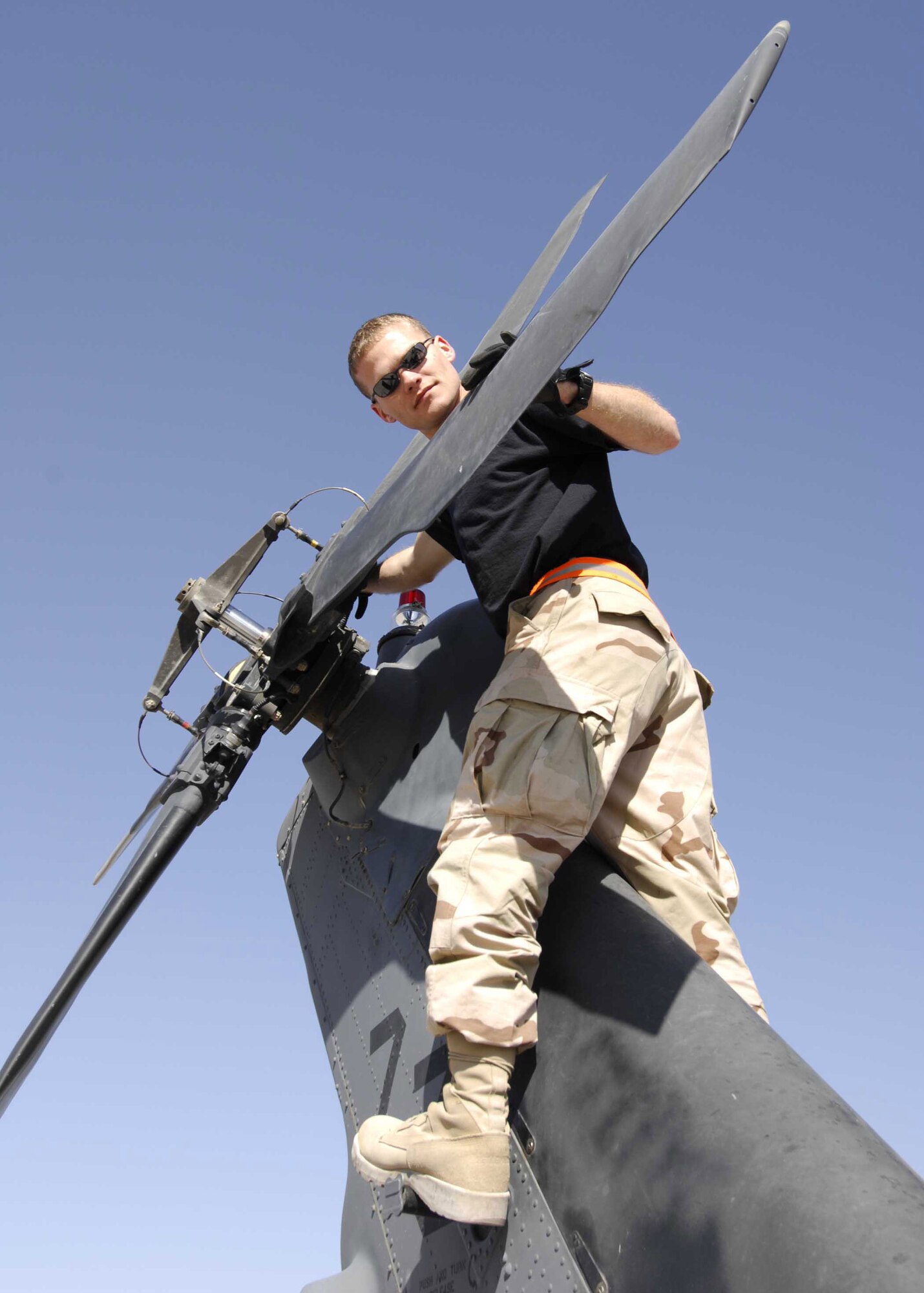 Staff Sgt. Jason McDowell inspects an HH-60 Pave Hawk helicopter at Kandahar Airfield, Afghanistan, Dec. 29. Since February, 2006, HH-60, like those assigned to the 33rd ERQS, have been flying alongside Army helicopters to help provide medical evacuation throughout Afghanistan.  (U.S. Air Force Photo/Capt. Michael Meridith)