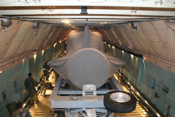 The 445th Airlift Wing's C-5 aircraft transports the Advance SEAL Delivery System (ASDS), a type of Navy submarine, from McChord AFB, Wash., to its final destination, Pearl Harbor, Dec. 12, 2007.  The weight of the cargo tips the scales for the wing's heaviest move.  (U.S. Air Force photo/Mary Allen)  