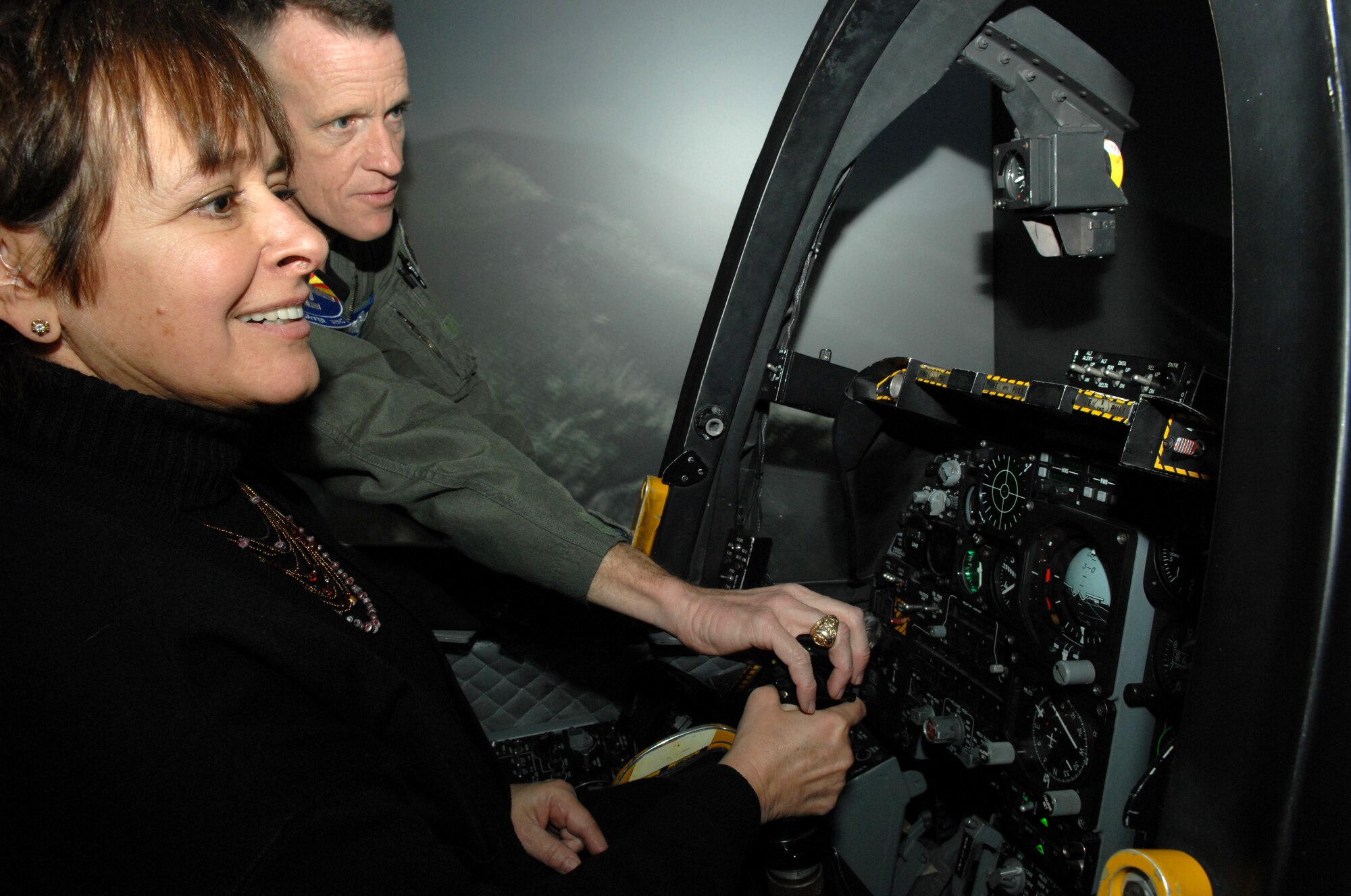 During a visit to D-M Dec. 28, Tucson City Council member and Vice-Mayor Nina Trasoff gets an A-10 flight simulator orientation from 355th Fighter Wing Commander Col. Kent Laughbaum. Trasoff represents a community neighboring D-M and has worked together with the commander on issues ranging from noise abatement to communiyt involvment. 