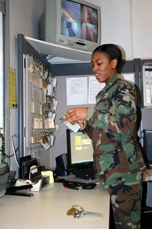 Senior Airman Cassandra West, 341st Security Forces Support Squadron security controller, takes inventory of the keys and codes that people check out for their work centers, and replaces them once they have been returned back to the 341st SSPTS back office. Airman West will be working over the holidays. (U.S. Air Force photo/Senior Airman Eydie Sakura).