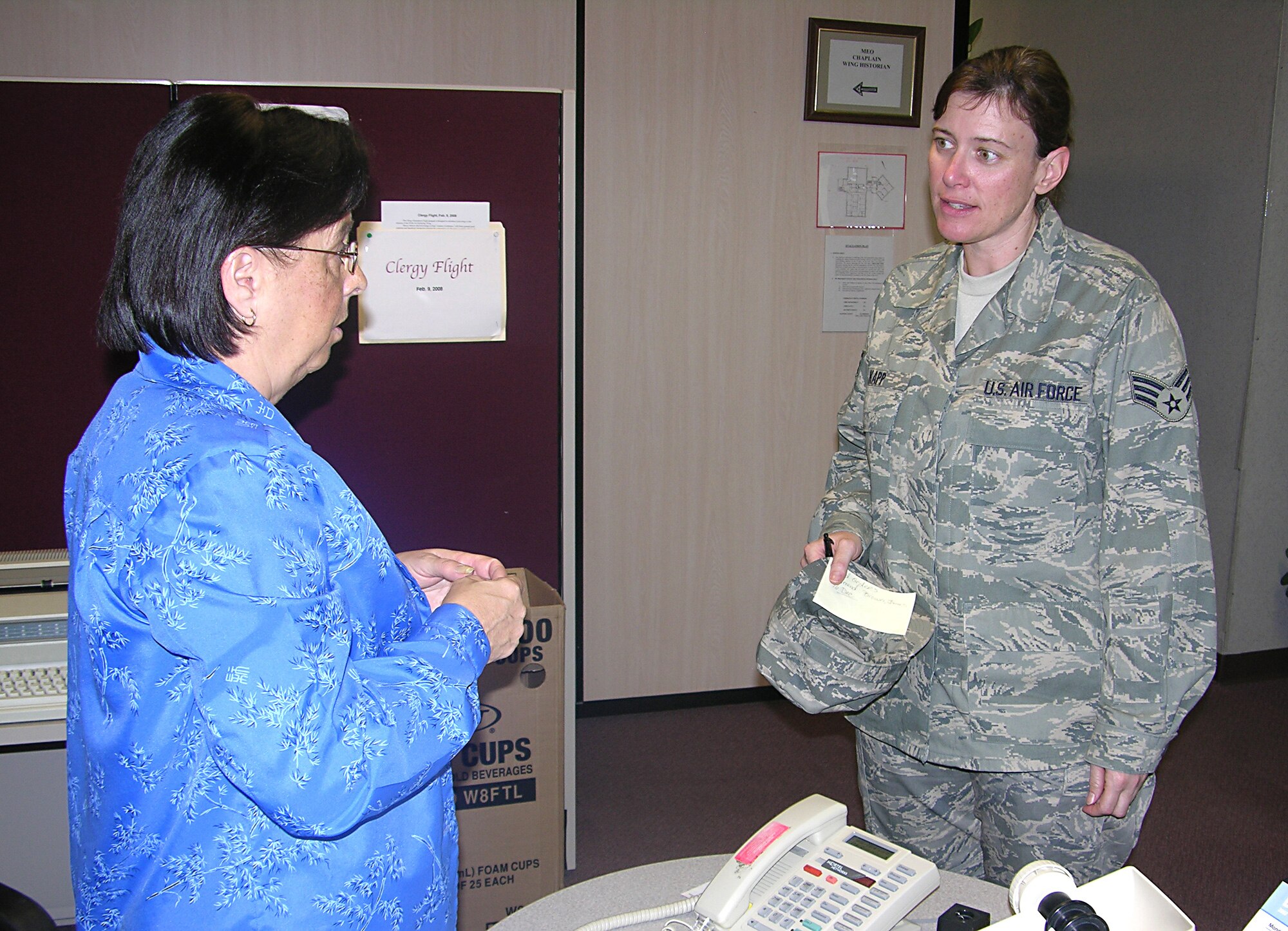 SEYMOUR JOHNSON AIR FORCE BASE, N.C.--Senior Airman Charlene L. Kapp, a personnel apprentice with the commander support staff, 916th Aircraft Maintenance Squadron here, discusses some of the features of the new Airman Battle Uniform with Ms. Donna Lea, the public affairs assistant with the 916th Public Affairs Office here.