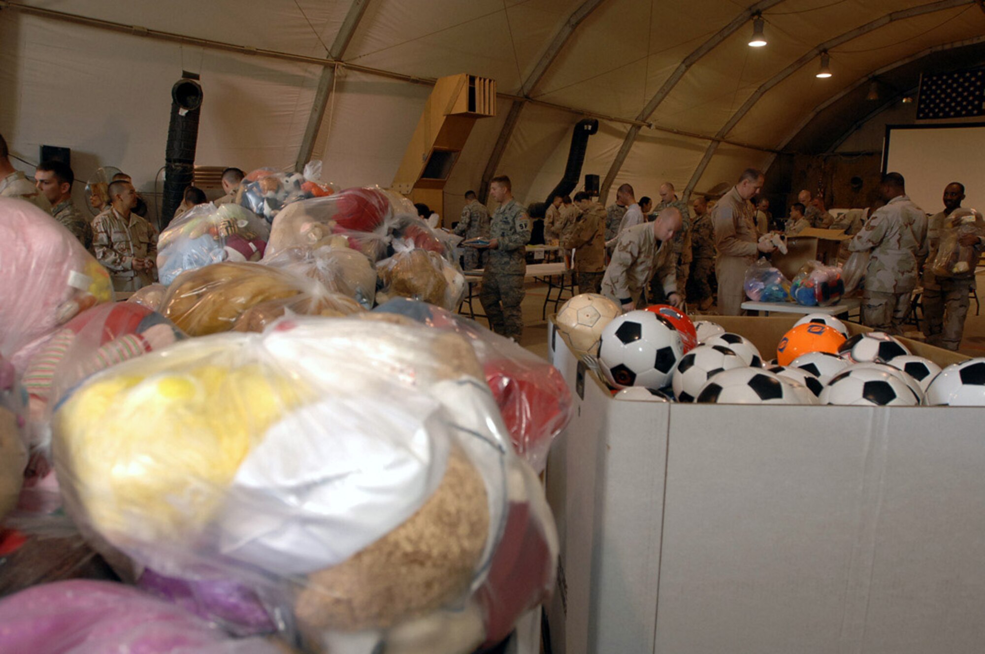 After only a few hours of sorting and organizing at Ali Base, Iraq, Dec. 22, more than four tons of supplies are now ready to be given out in support of Operation Iraqi Child.  Airmen on base collected thousands of school supply items, soccer balls, stuffed animals and toys in just over a month, from family and friends in the U. S. The donated items will be given to Iraqi families in the An Nasiriyah area. (U.S. Air Force photo/Airman 1st Class Jonathan Snyder) 