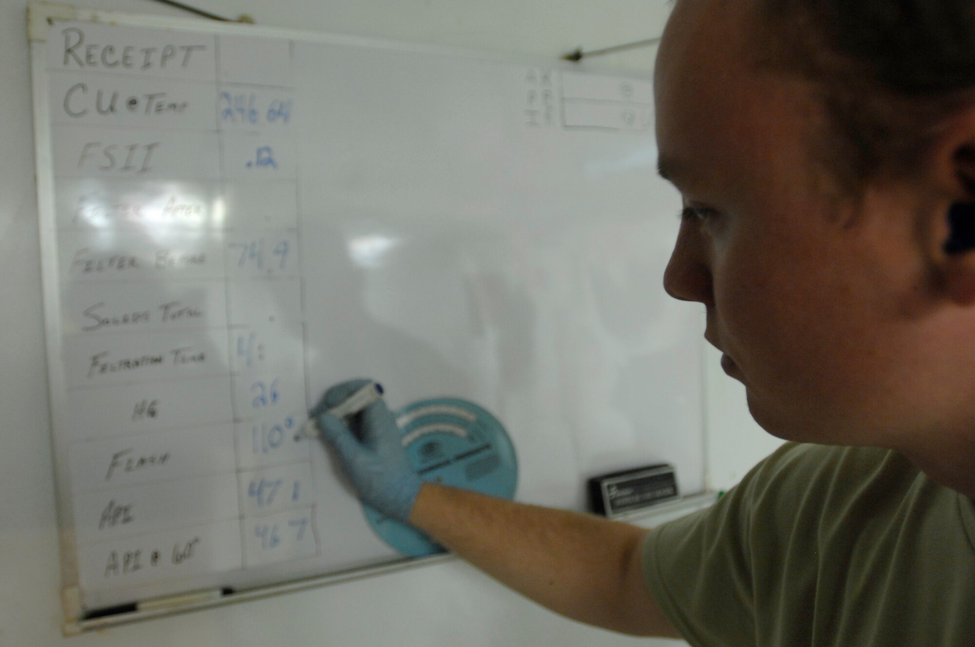 ALI AIR BASE, Iraq -- Senior Airman Jay Pickle writes down all the information of his test results Dec. 28. A sample of fuel must be tested for every fuel shipment received to ensure the quality meets the strict standards to be used in Air Force aircraft. He is assigned to the 407th Expeditionary Logistics Readiness Squadron and is deployed from Yokota Air Base, Japan. (U.S. Air Force photo/Airman 1st Class Jonathan Snyder)