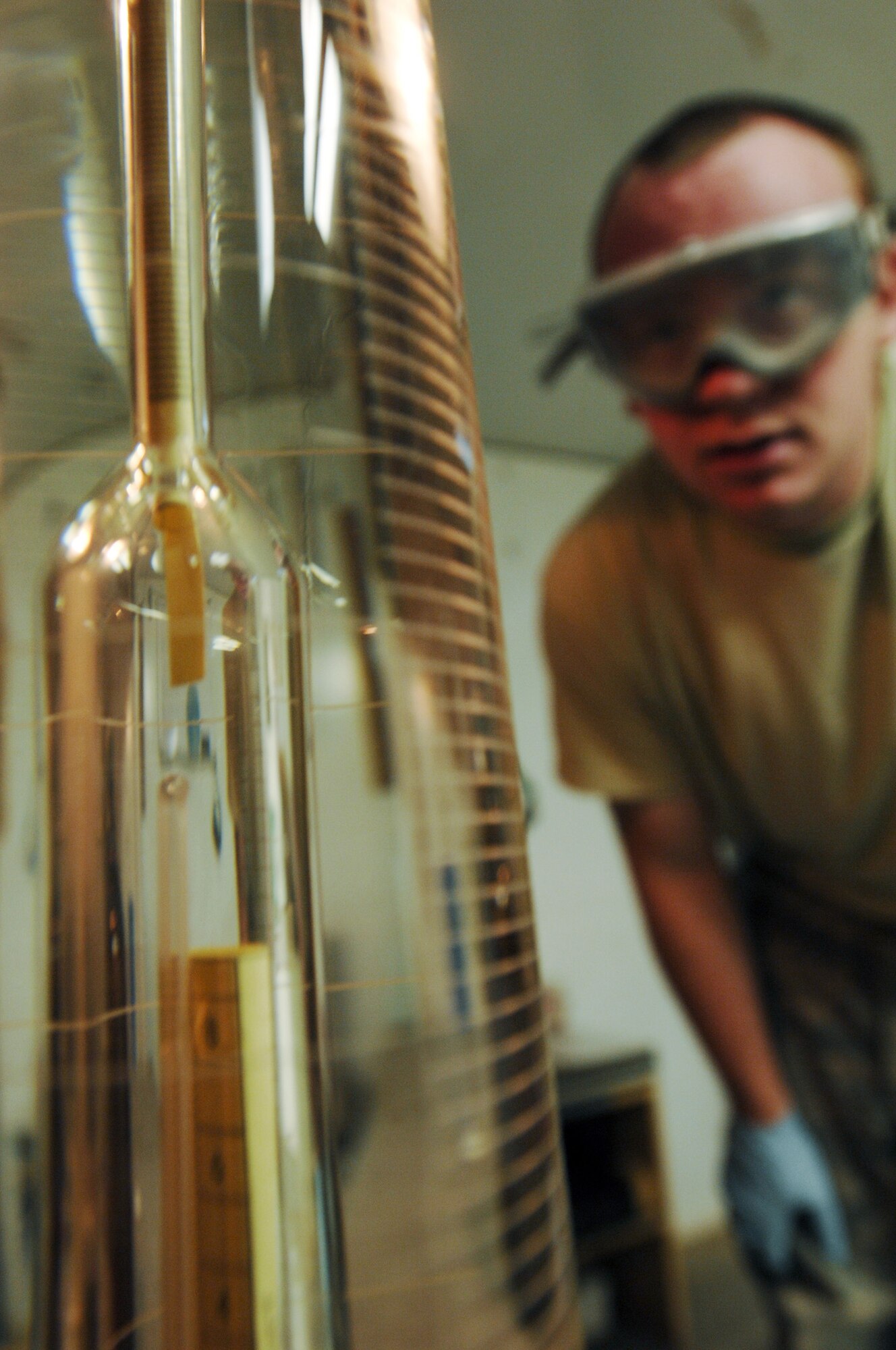 ALI AIR BASE, Iraq -- Senior Airman Jay Pickle conducts a hydrometer test to adjust to the correct volume temperature Dec. 28. A sample of fuel must be tested for every fuel shipment received to ensure the quality meets the strict standards to be used in Air Force aircraft. He is assigned to the 407th Expeditionary Logistics Readiness Squadron and is deployed from Yokota Air Base, Japan. (U.S. Air Force photo/Airman 1st Class Jonathan Snyder)