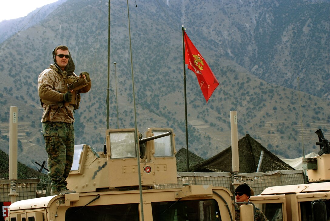 Marine Sgt. Will D. Craig (left) of Culleoka, Tenn., and Petty Officer 1st Class Reynaldo S. Datu prepare for a recent convoy from Forward Operating Base Naray, Konar Province, Afghanistan. The two are assigned to Embedded Training Team 7-2, deployed to Afghanistan from Okinawa, Japan, to work with the Afghan National Army.