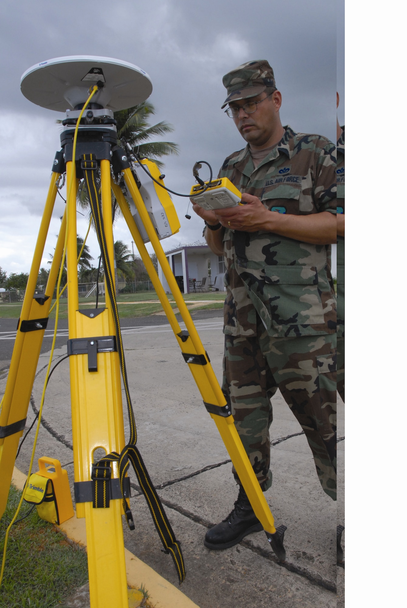 Technical Sgt. Raymond Linares uses GPS equipment to survey the surrounding work site during a deployment for training at U.S. Coast Guard Air Station Borinquen, Puerto Rico on March 6. Members of the 163rd Civil Engineering Squadron deployed to Puerto Rico to help with the renovation of a base facility. (U.S. Air Force photo by Senior Airman Diane Ducat )