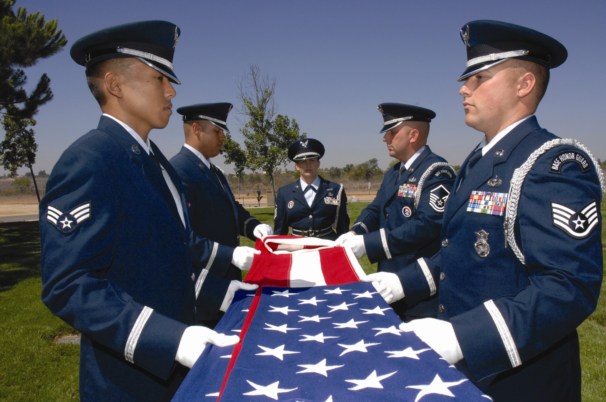 U.S. Air Force members of the Blue Eagles Total Force Honor Guard team practice their funeral services routine at March Air Reserve Base on August 8. The Blue Eagles Total Force Honor Guard has been performing services for Southern California since 1997. (U.S. Air Force photo by Staff Sergeant Eduardo Cervantes)