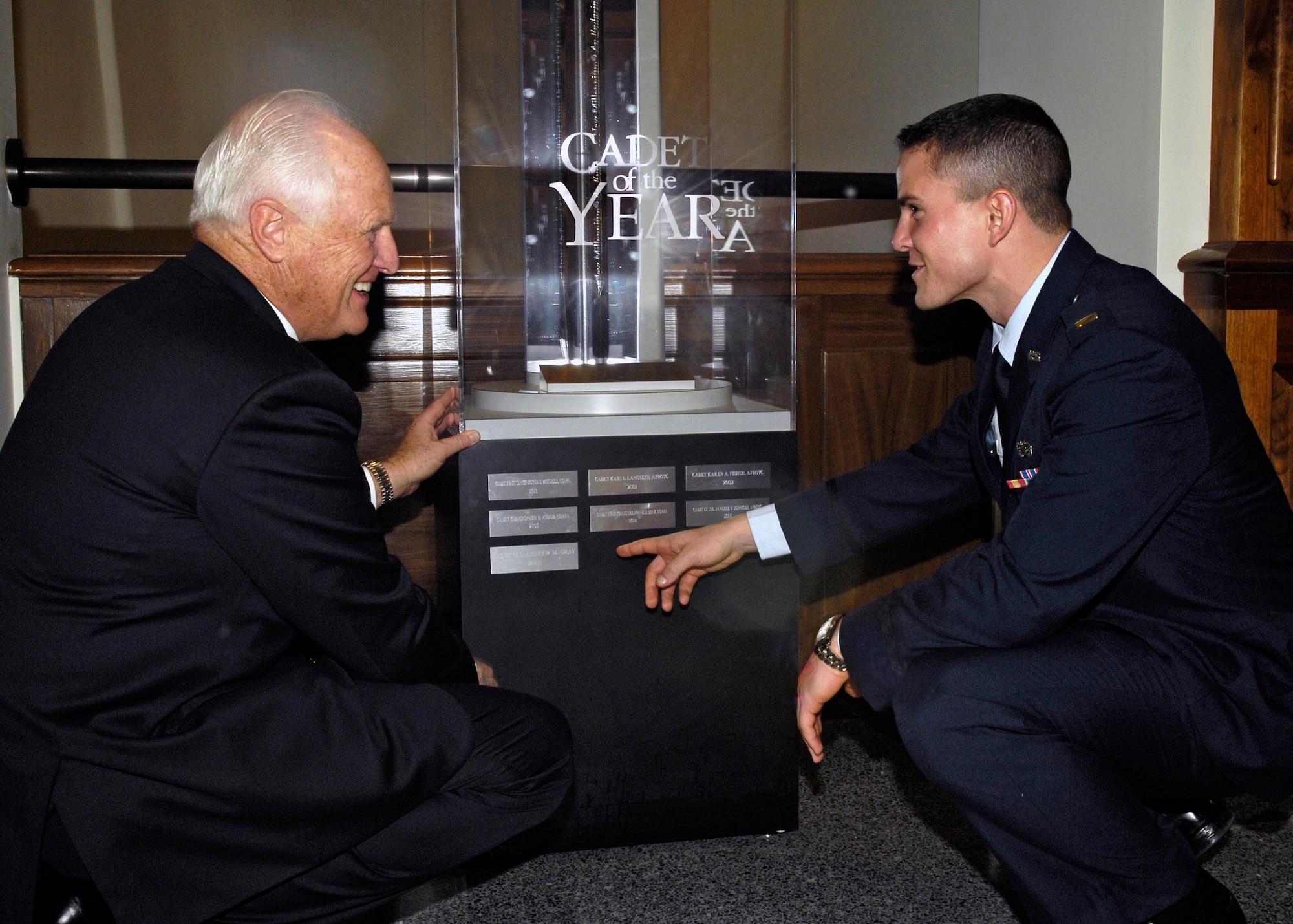 Winston S. Churchill, grandson of former British Prime Minister Winston Churchill, and 2nd Lt. Brandon T. Dues, a graduate of the Air Force Academy last May, admire the "Millennium Sword," which is presented to recipients of the Cadet of the Year award. Lieutenant Dues was the 2007 recipient.  The sword is kept on permanent display in the Pentagon. (U.S. Air Force photo/Donna Parry)