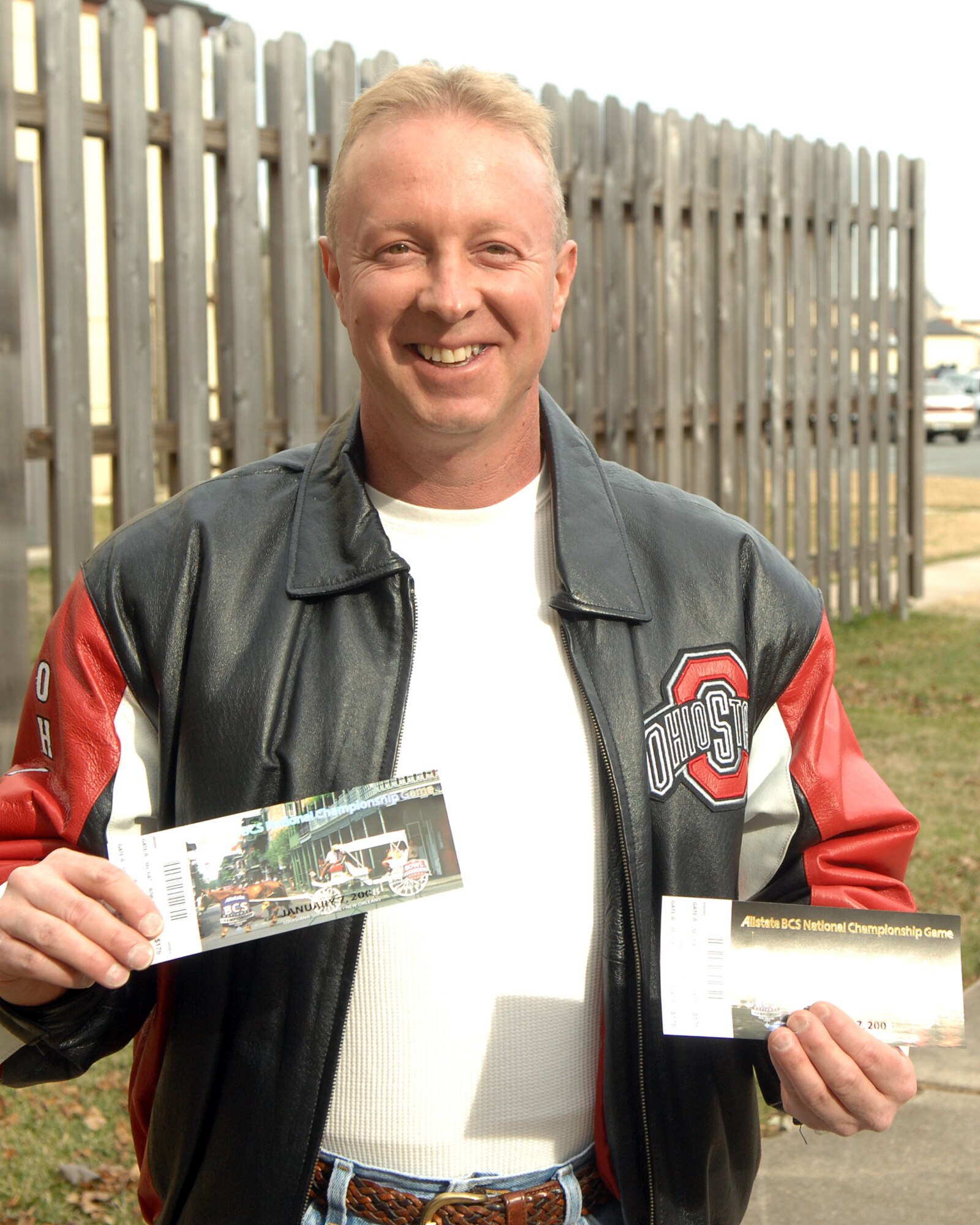Senior Master Sgt. Mark Sheets, 2d Maintenance Group, shows off his pair of tickets to the biggest game in college football.  Sergeant Sheets and his wife were selected by base leadership to recieve a pair of tickets to the BCS Championship Game between The Ohio State University and The Louisiana State University.  The tickets were donated the 2d Bomb Wing by an anonymous Ohio State Football fan.  