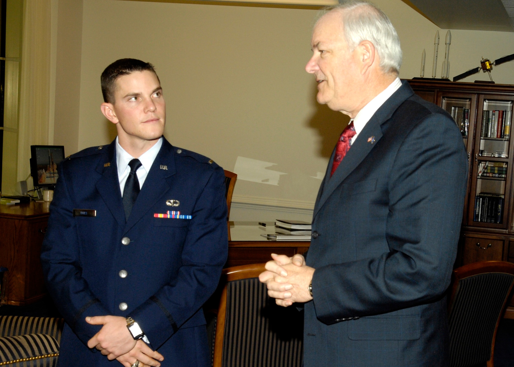 Secretary of the Air Force Michael W. Wynne speaks with 2nd Lt. Brandon T. Dues, a graduate of the Air Force Academy last May. Lieutenant Dues is the recipient of the 2007 Cadet of the Year award. The award recognizes the most outstanding cadet in an Air Force commissioning program. (U.S. Air Force photo/Donna Parry)