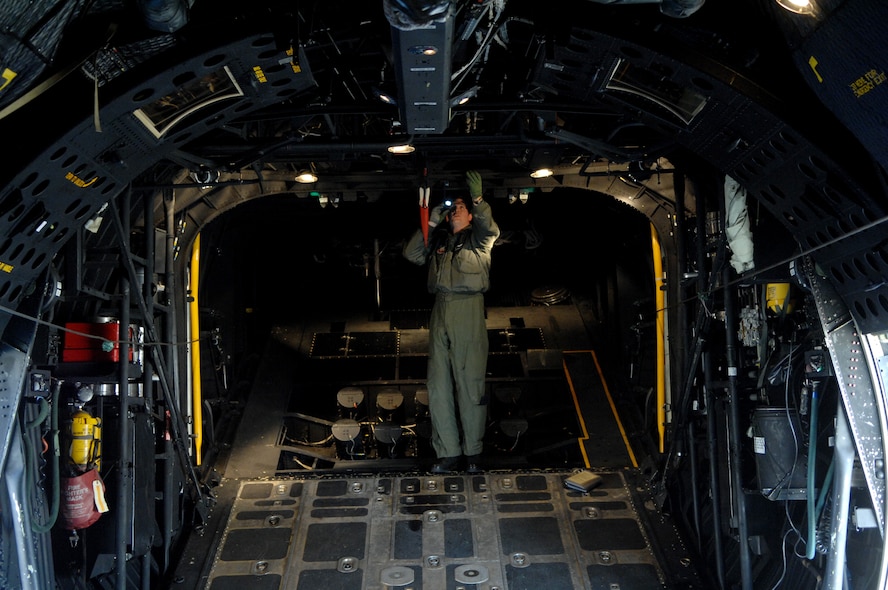 MOODY AIR FORCE BASE, Ga. -- Senior Airman Pat Clendenning, 71st Rescue Squadron flight engineer, performs preflight inspections on an HC-130P Combat King Jan. 3 here. A thorough inspection is made of the entire aircraft before every flight to ensure crew safety. (U.S. Air Force photo by Airman 1st Class Gina Chiaverotti)