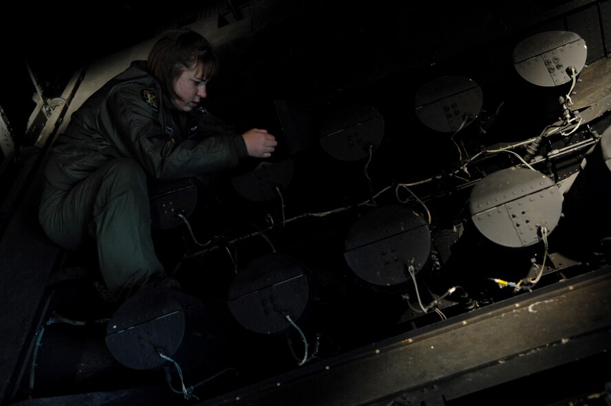 MOODY AIR FORCE BASE, Ga. -- Staff Sgt. Rebecca Rhodes, 71st Rescue Squadron loadmaster,  checks flares on an HC-130P Combat King Jan. 3 here. Flares are used to illuminate drop zones and rescue areas during nightime operations.  (U.S. Air Force photo by Airman 1st Class Gina Chiaverotti)