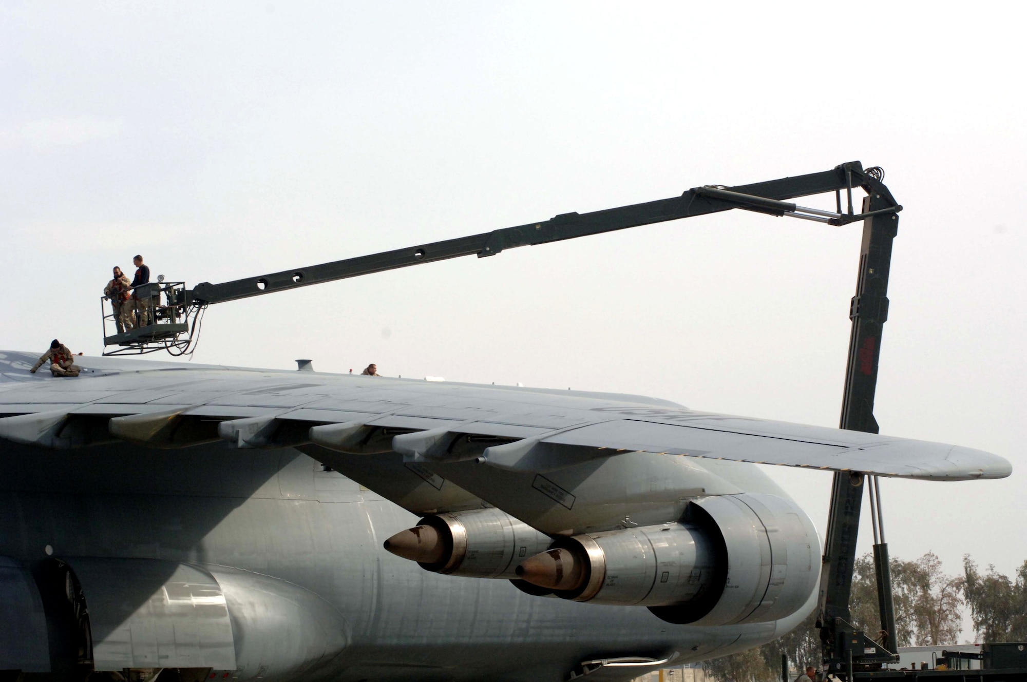 Members of the 721st Air Mobility Operations Group work to perform maintenance on a C-5 Galaxy Jan. 1 at Balad Air Base, Iraq. The 721st AMOG provides en route maintenance and support for the Air Force's C-5 and C-17 Globemaster III aircraft. The C-5 is one of the largest aircraft in the world and the largest airlifter in the Air Force inventory. The Airmen are deployed from Travis Air Force Base, Calif. (U.S. Air Force photo/Senior Airman Terri Barriere) 