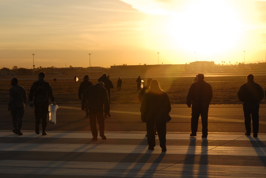 Airmen of the 56th Fighter Wing perform the annual wing foreign object debris (FOD) walk here on Jan. 3.  FOD detection saves the Air Force millions of dollars every year in extra parts and unscheduled maintenance. (photo by Staff Sgt. Jerry Fleshman)