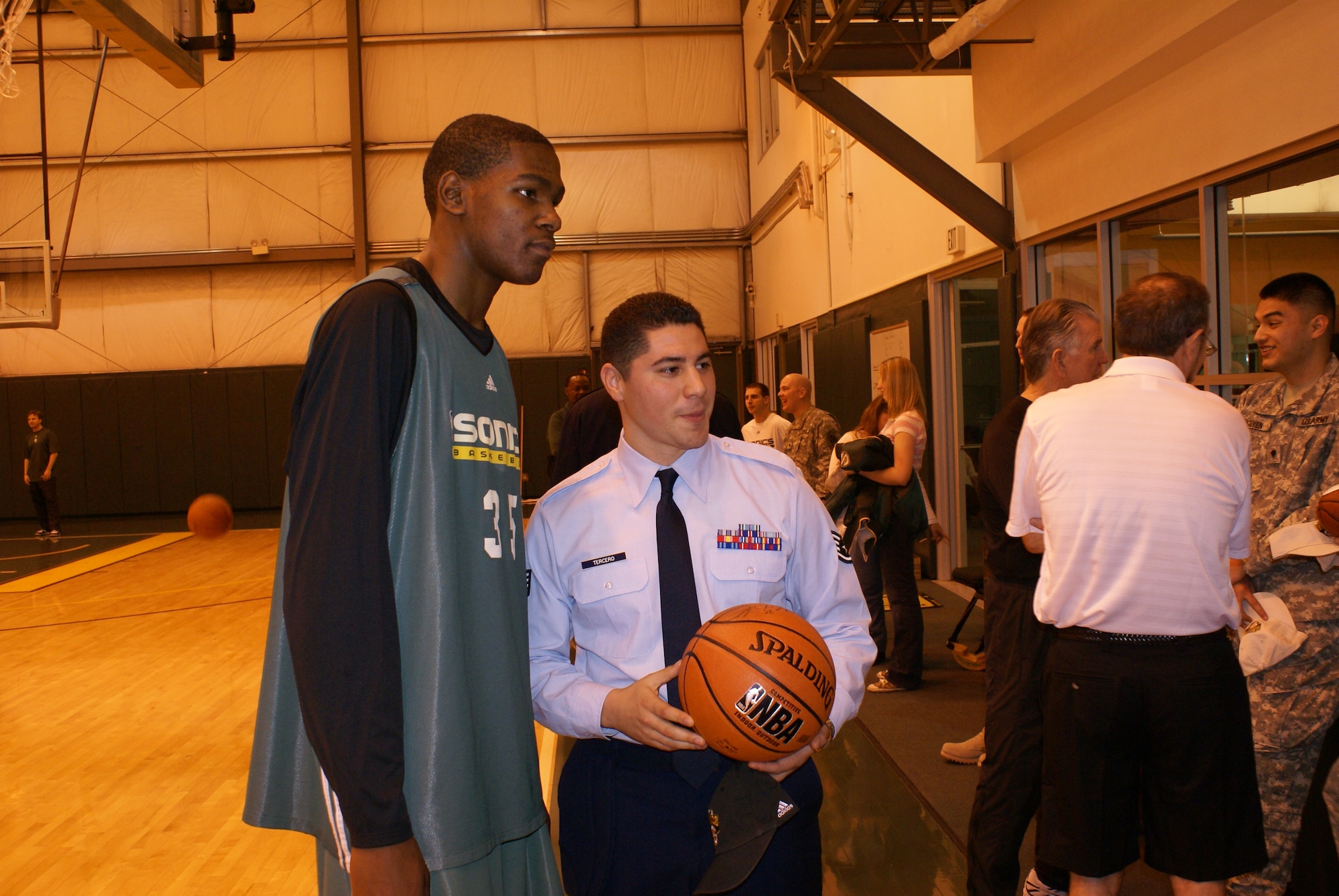 Staff Sgt. Daniel Tercero, 22nd Special Tactics Squadron, poses for a picture
with Sonics rookie Kevin Durant.