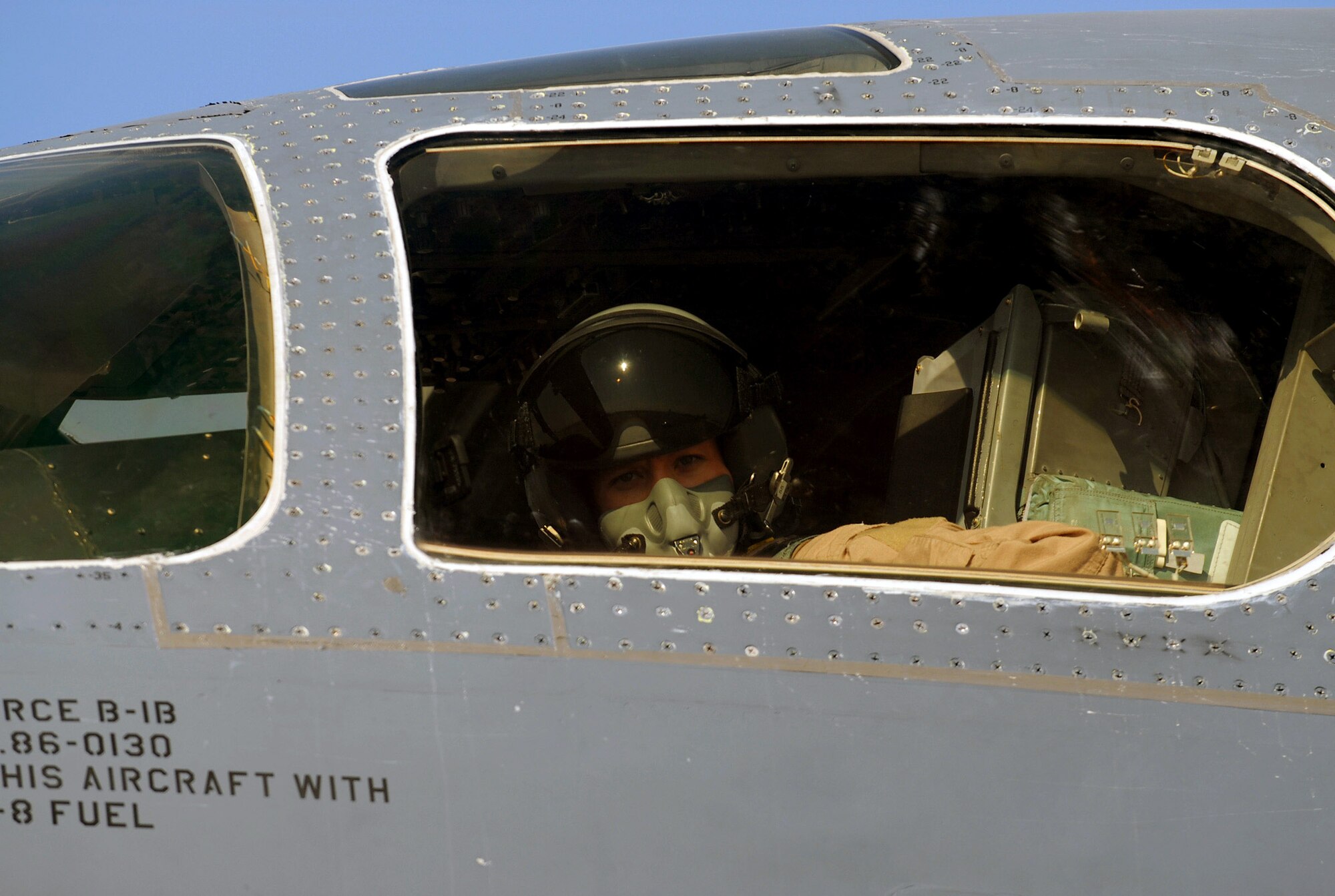 Capt. Crystal Powers settles into the pilot's seat of the B-1B Lancer bomber she will fly on a mission Dec. 29.  Captain Powers is an aircraft commander with the 9th Expeditionary Bomb Squadron at an air base in Southwest Asia. (U. S. Air Force photo/Staff Sgt. Douglas Olsen)