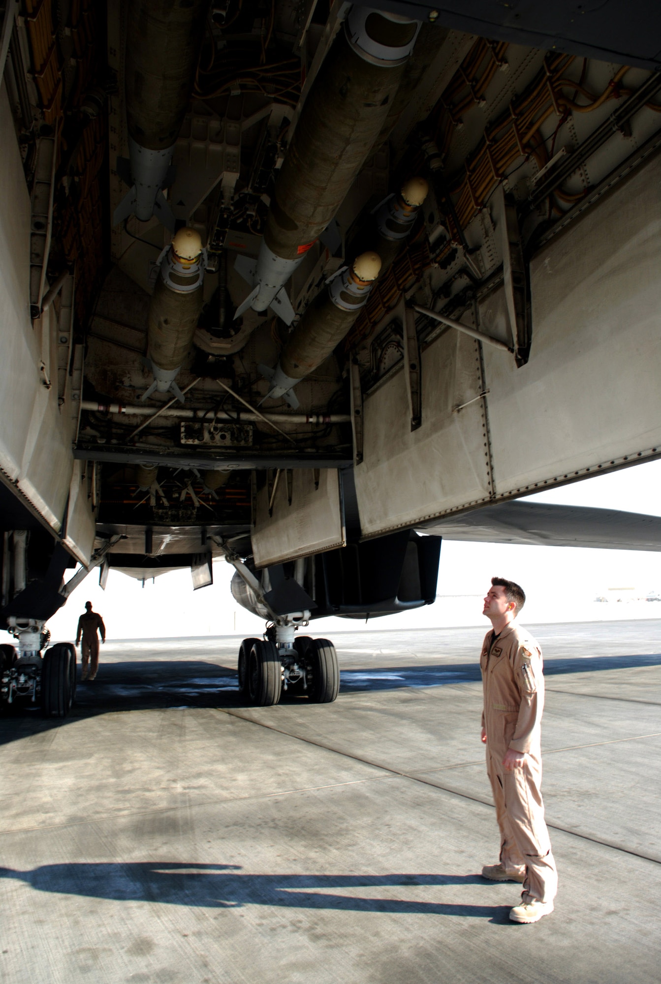 1st Lt. Jason Edwards checks the bomb load of a B-1B Lancer Dec. 29 as he and the rest of the aircrew preflight check the bomber prior to a mission.  Lieutenant Edwards is with the 9th Expeditionary Bomb Squadron at an air base in Southwest Asia. (U. S. Air Force photo/Staff Sgt. Douglas Olsen)