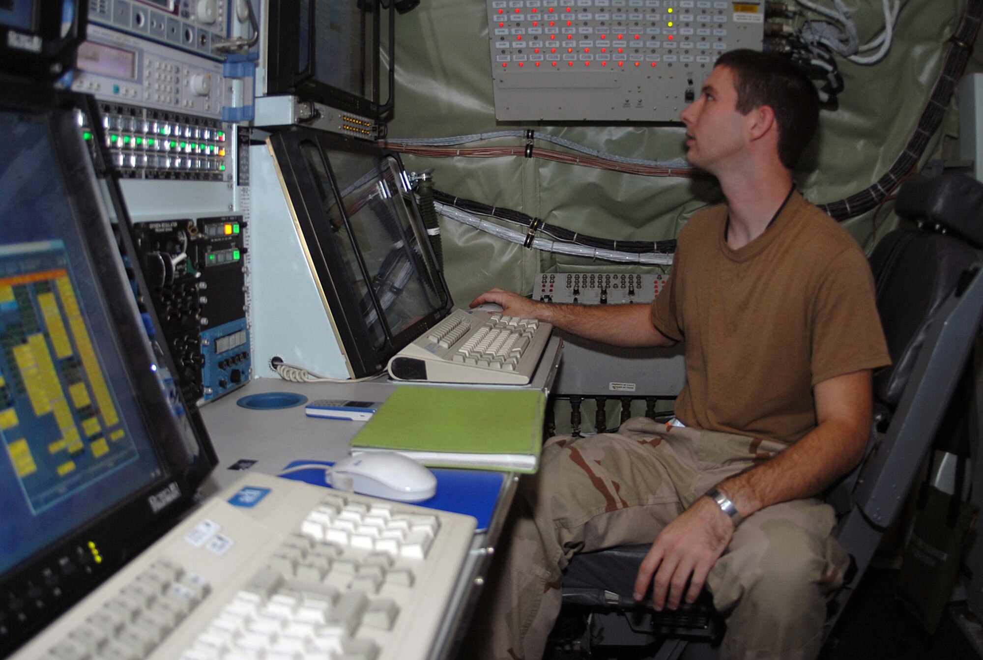 SOUTHWEST ASIA - Staff Sgt. Daniel Storey, 763rd Expeditionary Reconnaissance Squadron, runs tests on surveillance equipment on a RC-135 Rivet Joint aircraft at a Southwest Asia air base Jan. 3. The 763 ERS is a tenant unit of the 379th Air Expeditionary Wing. Sergeant Storey is deployed from Offutt AFB, Neb. (U. S. Air Force photo/Staff Sgt. Douglas Olsen)