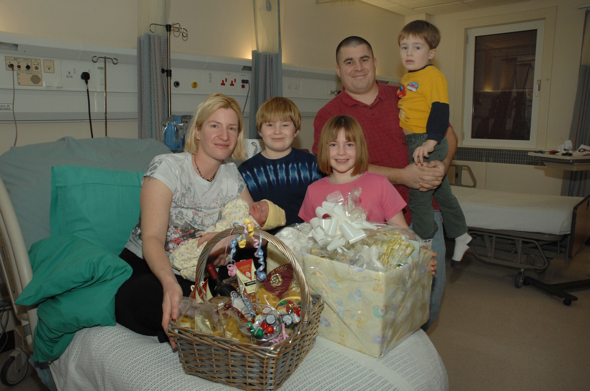 Tech. Sgt. David Delozier, Julianne Delozier and family surround their newest addition, Bryce Allen Delozier at the Lakenheath Hospital Jan. 1. Bryce was the first military baby born in Europe in 2008. He was born at 2:02 a.m., Jan 1 weighing 8 pounds and 8 ounces. (U.S. Air Force photo by Airman 1st Class John Easterling)

