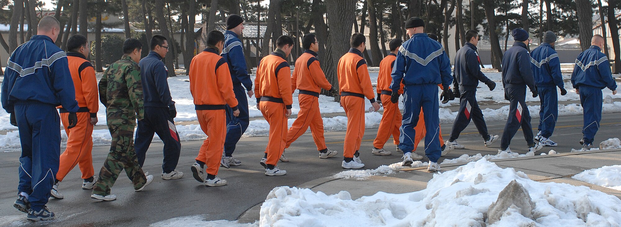 KUNSAN AIR BASE, South Korea -- Members of the 8th Security Forces Squadron and Korean soldiers march in formation here Jan. 5. The meeting between members of the Wolf Pack and Republic of Korea soldiers highlights the relationship between two ally nations. (U.S. Air Force photo/Senior Airman Giang Nguyen)