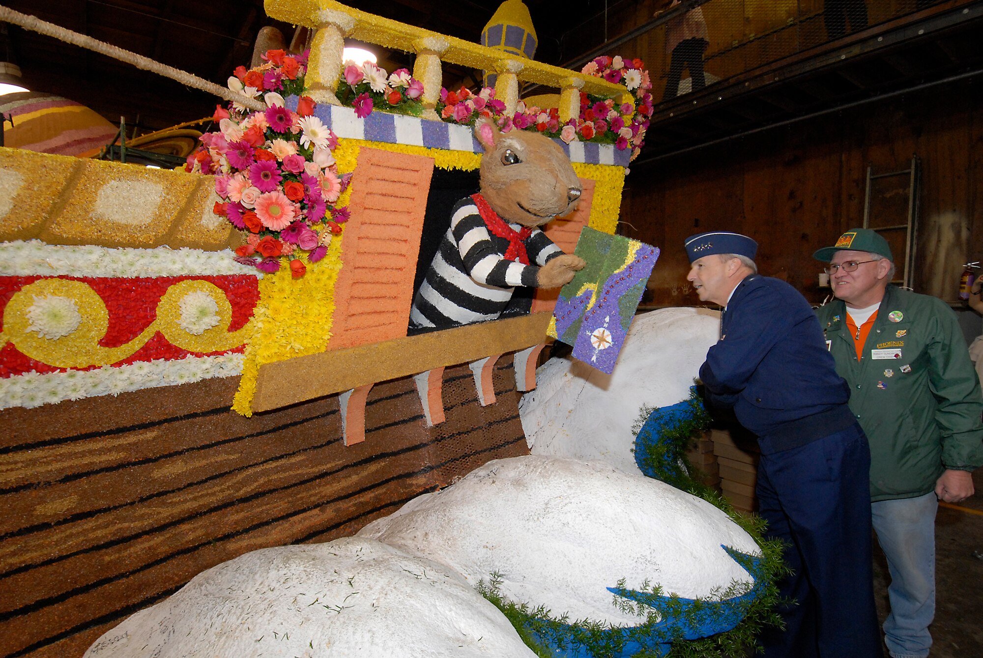 SMC Commander Lt. Gen. Michael Hamel  gets a close up view of the City of Anaheim’s Rose Parade Float (Photo by Joseph Juarez)