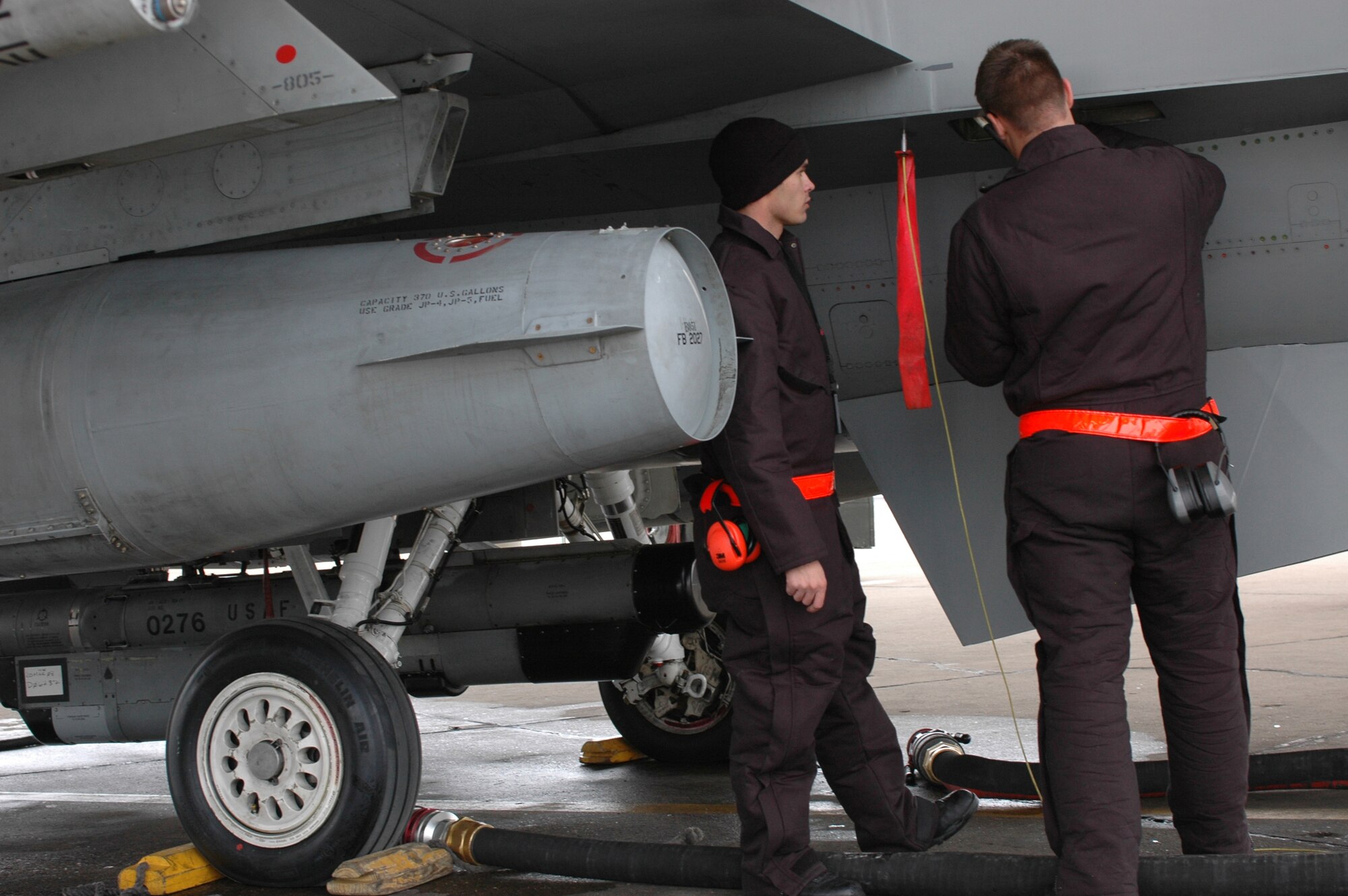 Senior Airman Jereamy Day and Airman 1st Class Corey Brillinger, both crew chiefs in the 388th Aircraft Maintenance Squadron, work to install a chaff and flare dispensar in an F-16.  In November 2007, the 388th AMXS was recognized with Air Combat Command's mid-sized Maintenance Effectiveness Award.  (Photo by 1st Lt. Beth Woodward)