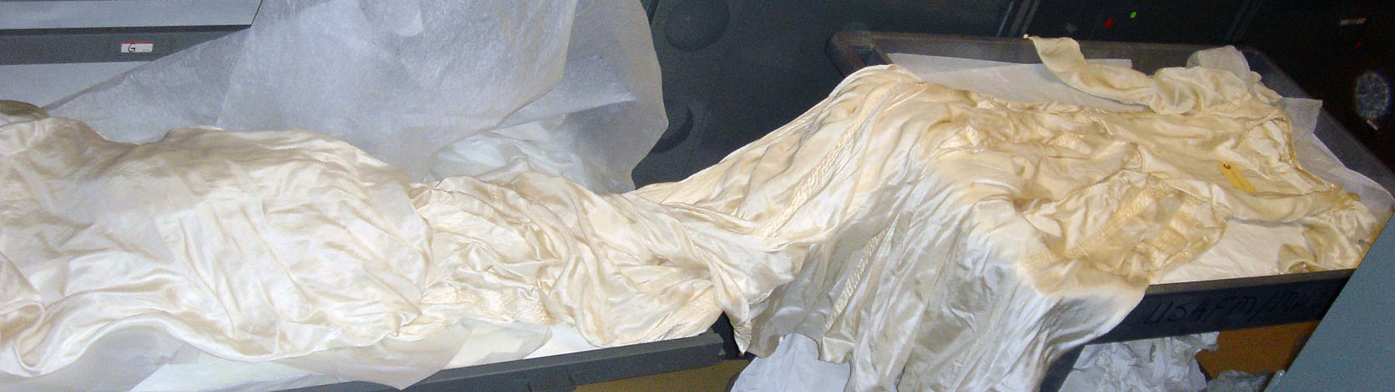 This bridal gown was made of strips from nine parachutes that saved the lives of nine U.S. flyers behind enemy lines in China during World War II. (U.S. Air Force photo)