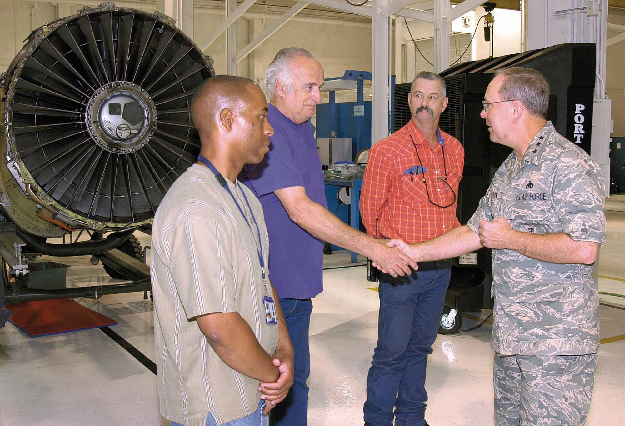 Lt. Gen. Kevin Sullivan, Deputy Chief of Staff for Logistics, Installations and Mission Support at the Pentagon, meets Tinker TF33 personnel in the new jet engine intermediate maintenance shop, located in Bldg. 3705.  The general helped officially open the shop Oct. 10 with a ceremonial ribbon cutting moments earlier. (Air Force photo by Margo Wright)

