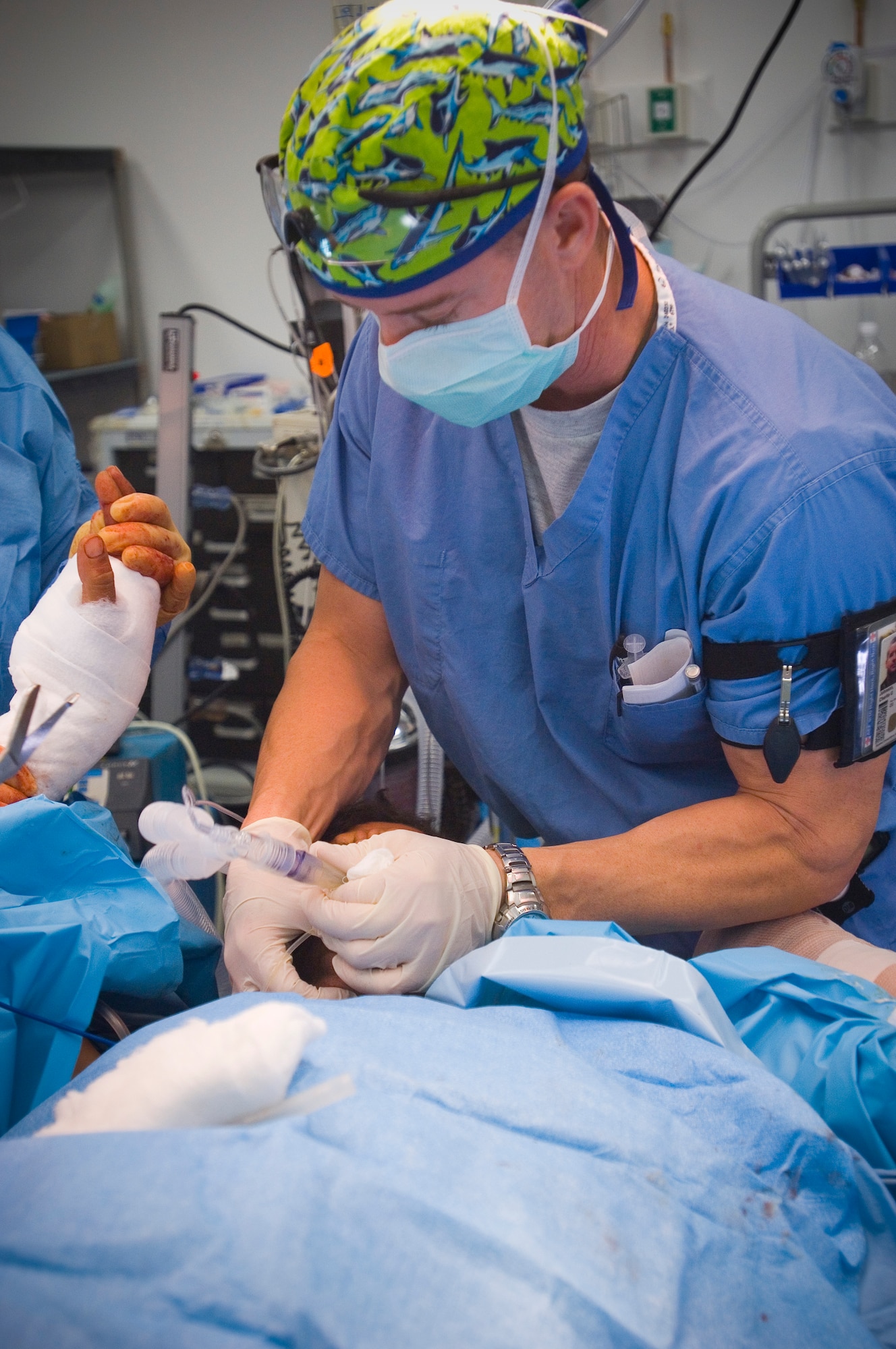 BALAD AIR BASE, Iraq -- Capt. Charlie Johnson, a certified registered nurse anesthetist, prepares to extubate -- or remove a breathing tube -- from a patient following a surgical procedure at the Air Force Theater Hospital here. Captain Johnson is responsible for intubating patients, monitoring their vitals, providing  intravenous medications, and providing anesthesia. He is deployed from Travis Air Force Base, Calif. (U.S. Air Force photo/Tech. Sgt. D. Clare)