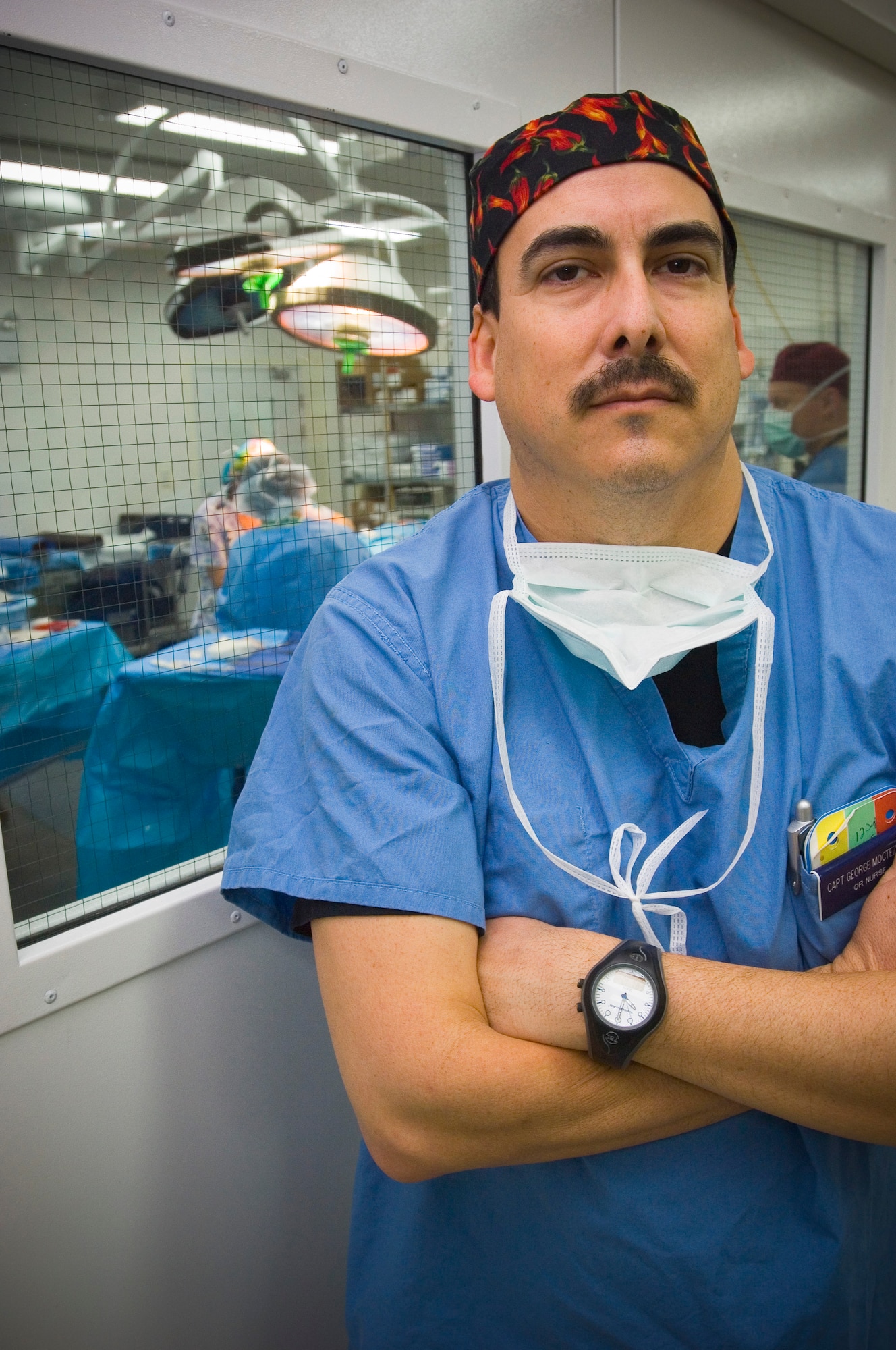 BALAD AIR BASE, Iraq -- Capt. George Moctezuma, an operating room nurse, serves as the "eyes and ears" of the Air Force Theater Hospital OR, preparing for and facilitating life-saving surgical procedures here. The captain earned his degree in nursing while serving as an enlisted Air Force medic. Capt. Moctezuma is deployed from Wilford Hall Medical Center, San Antonio, Texas. (U.S. Air Force photo/Tech. Sgt. D. Clare)