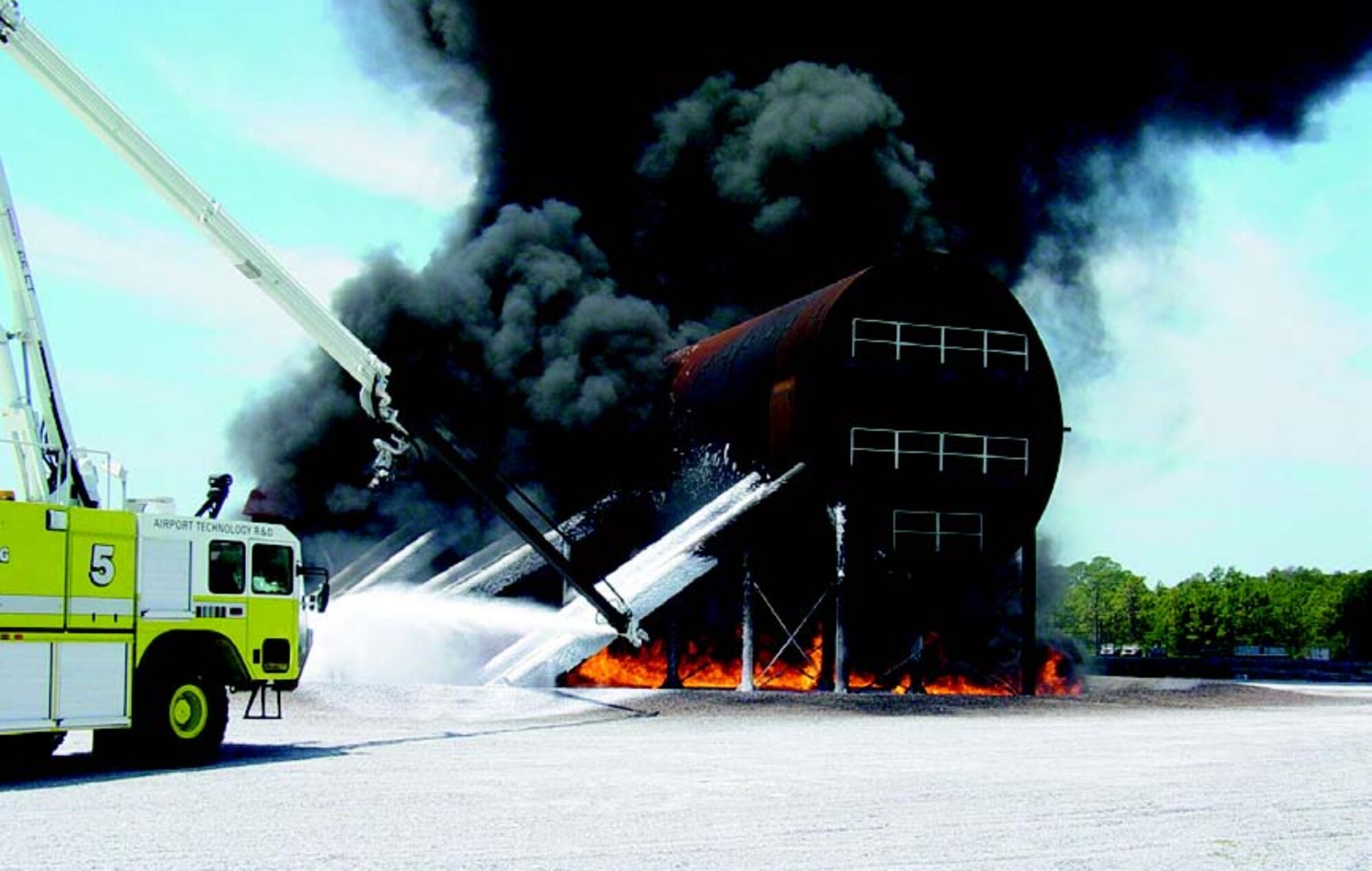 Engineers demonstrate the penetrator nozzle on the new 65 ft high-reach extendable turret installed on the Federal Aviation Administration Striker firefighting vehicle.