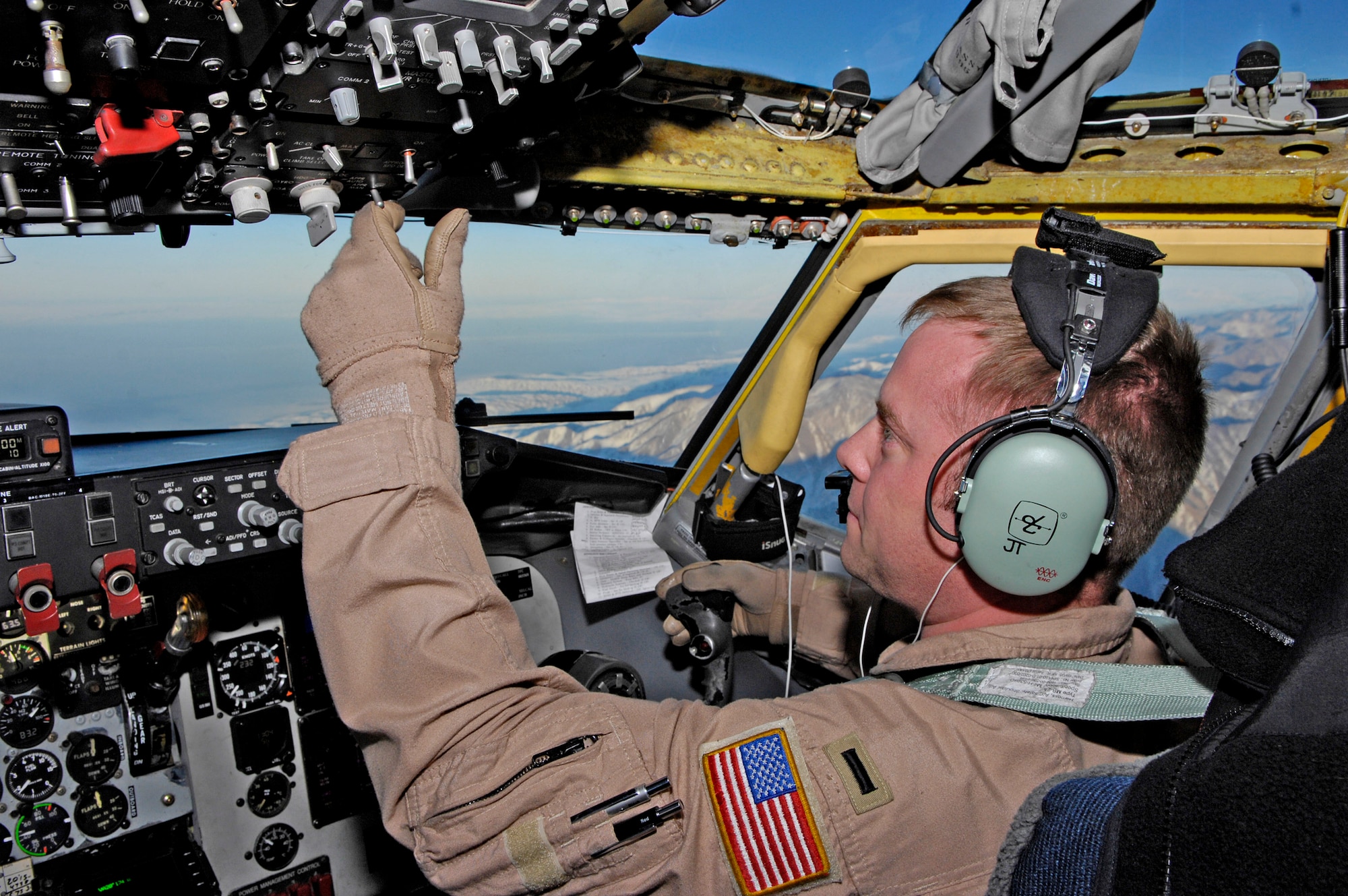 1st Lt. Justin Tiffany, a co-pilot on a KC-135 Stratotanker,  flies over the mountains of Afghanistan as he heads back to base after refueling a B-1B Lancer. The 22nd EARS primarily refuels aircraft in and around Afghanistan. Lieutinant Tiffany is deployed with the 22nd Expeditionary Air Refueling Squadron at Manas Air Base, Kyrgyzstan. He is assigned to the 92nd Air Refueling Wing at Fairchild Air Force Base, Wash., (U.S. Air Force photo/Staff Sgt. Angelique Perez)