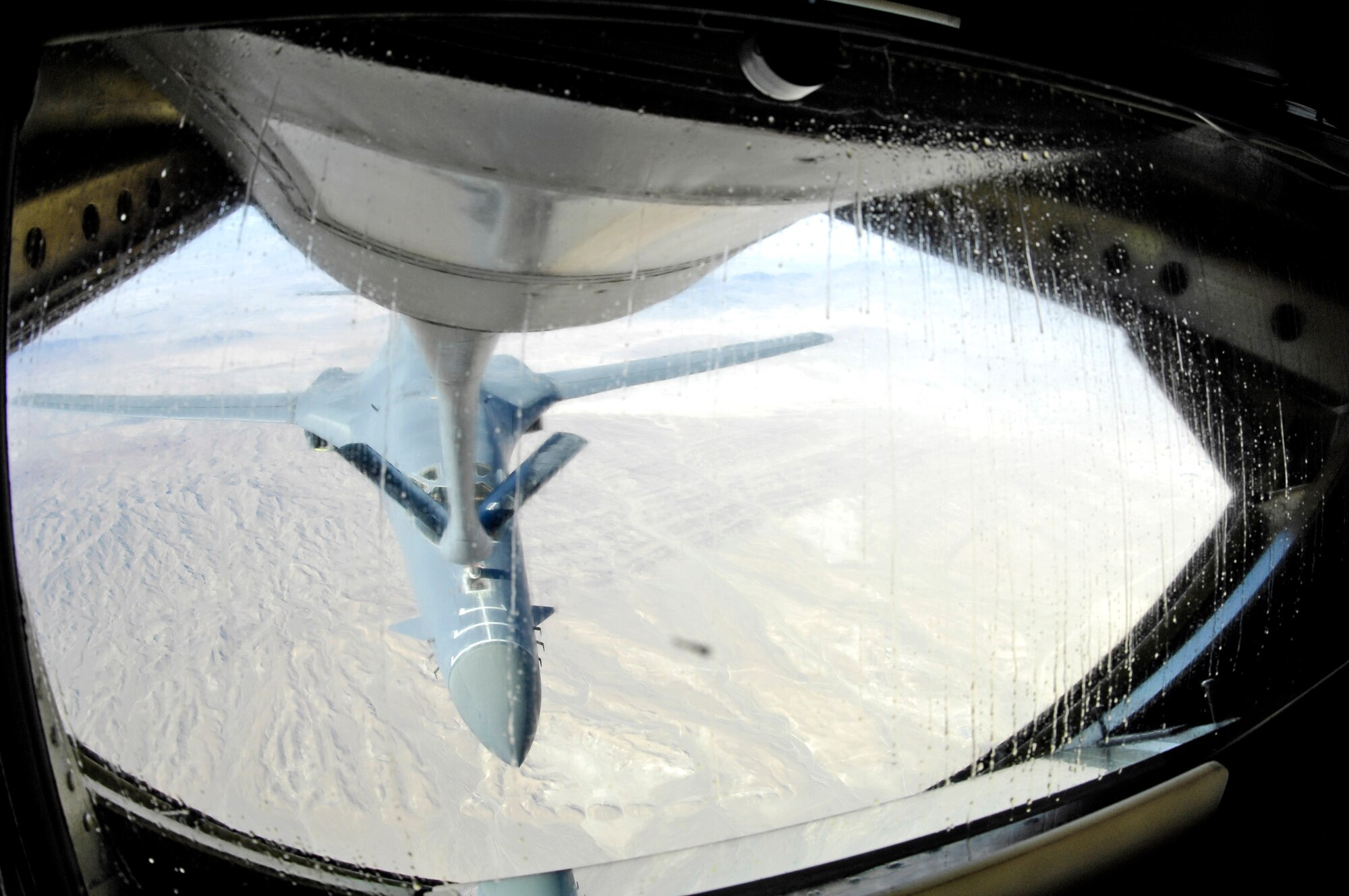 0A B-1B Lancer from the 9th Expeditionary Bomb Squadron flies up to the boom of a KC-135 Stratotanker from the 22nd Expeditionary Air Refueling Squadron at Manas Air Base, Kyrgyzstan, and deployed from the 92nd Air Refueling Wing, Fairchild Air Force Base, Wash., over Afghanistan. The 22nd EARS refuels aircraft in and around Afghanistan. (U.S. Air Force photo/Staff Sgt. Angelique Perez)