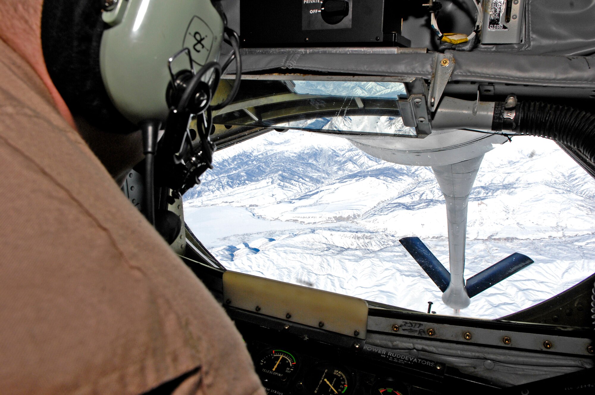 Tech. Sgt. Chris Rueckert checks the movement of the boom prior to refueling a B-1B Lancer over Afghanistan Jan. 1. Sergeant Rueckert is the chief boom operator and first sergeant for the 22nd Expeditionary Air Refueling Squadron at Manas Air Base, Kyrgyzstan. Sergeant Rueckert is deployed from the 92nd Air Refueling Wing, Fairchild Air Force Base, Wash. (U.S. Air Force photo/Staff Sgt. Angelique Perez)