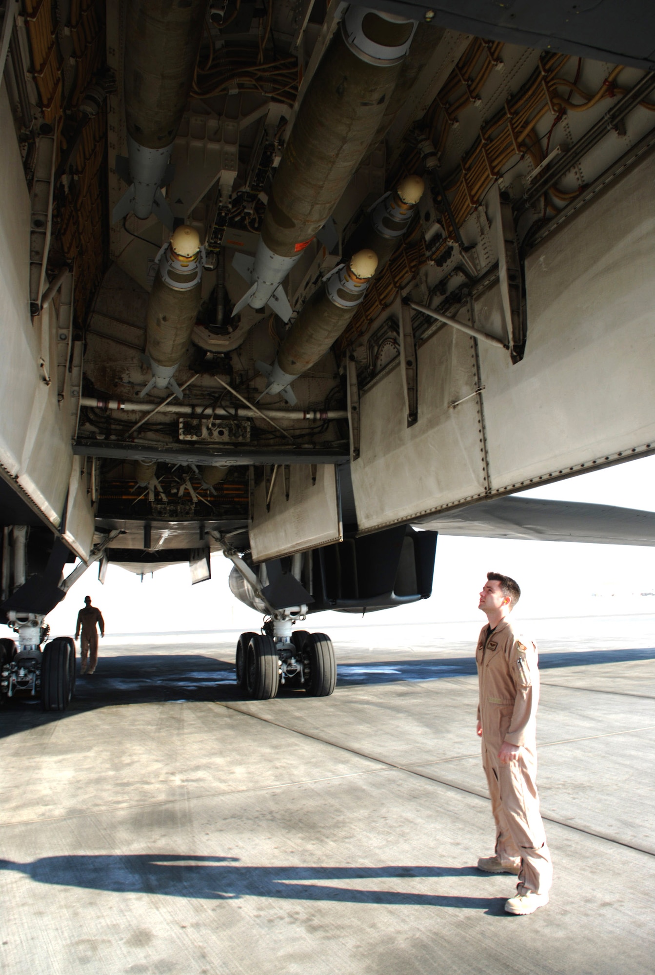 1st Lt. Jason Edwards checks the bomb load of a B-1B Lancer Dec. 29 as he and the rest of the aircrew preflight check the bomber prior to a mission. Lieutenant Edwards is with the 9th Expeditionary Bomb Squadron at an air base in Southwest Asia. (U. S. Air Force photo/Staff Sgt. Douglas Olsen)