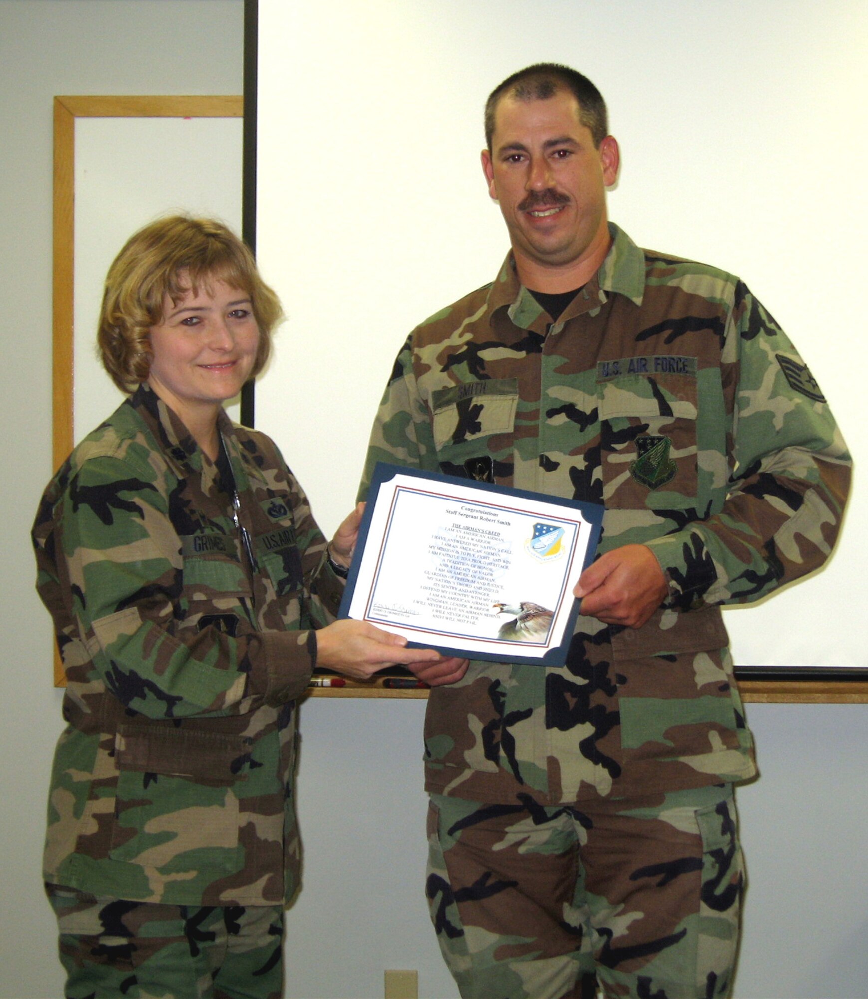 SEYMOUR JOHNSON AIR FORCE BASE, N.C.--Staff Sgt. Robert Smith, a utilities journeyman with the 916th Civil Engineer Squadron here, received his promotion certificate during the 916th Air Refueling Wing's Unit Training Assembly in December.