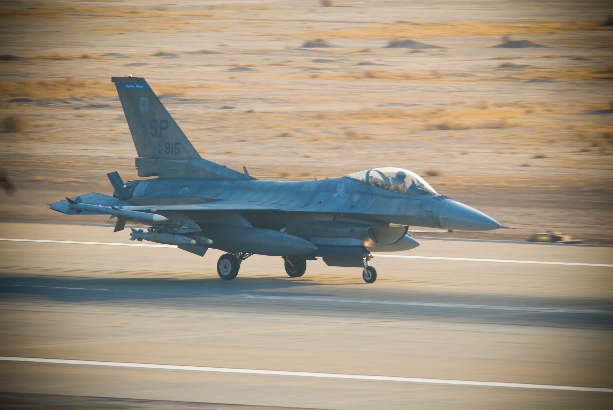 BALAD AIR BASE, Iraq -- An F-16C Fighting Falcon from the 22nd Expeditionary Fighter Squadron lands here Jan. 3. The 22nd EFS flies missions daily in support of Operation Iraqi Freedom. The F-16 can fly more than 500 miles, deliver it’s weapons with superior accuracy, defend itself against enemy aircraft and return to its starting point. The 22nd EFS is deployed from Spangdahlem Air Base, Germany (U.S. Air Force photo/Master Sgt. John Nimmo, Sr.)