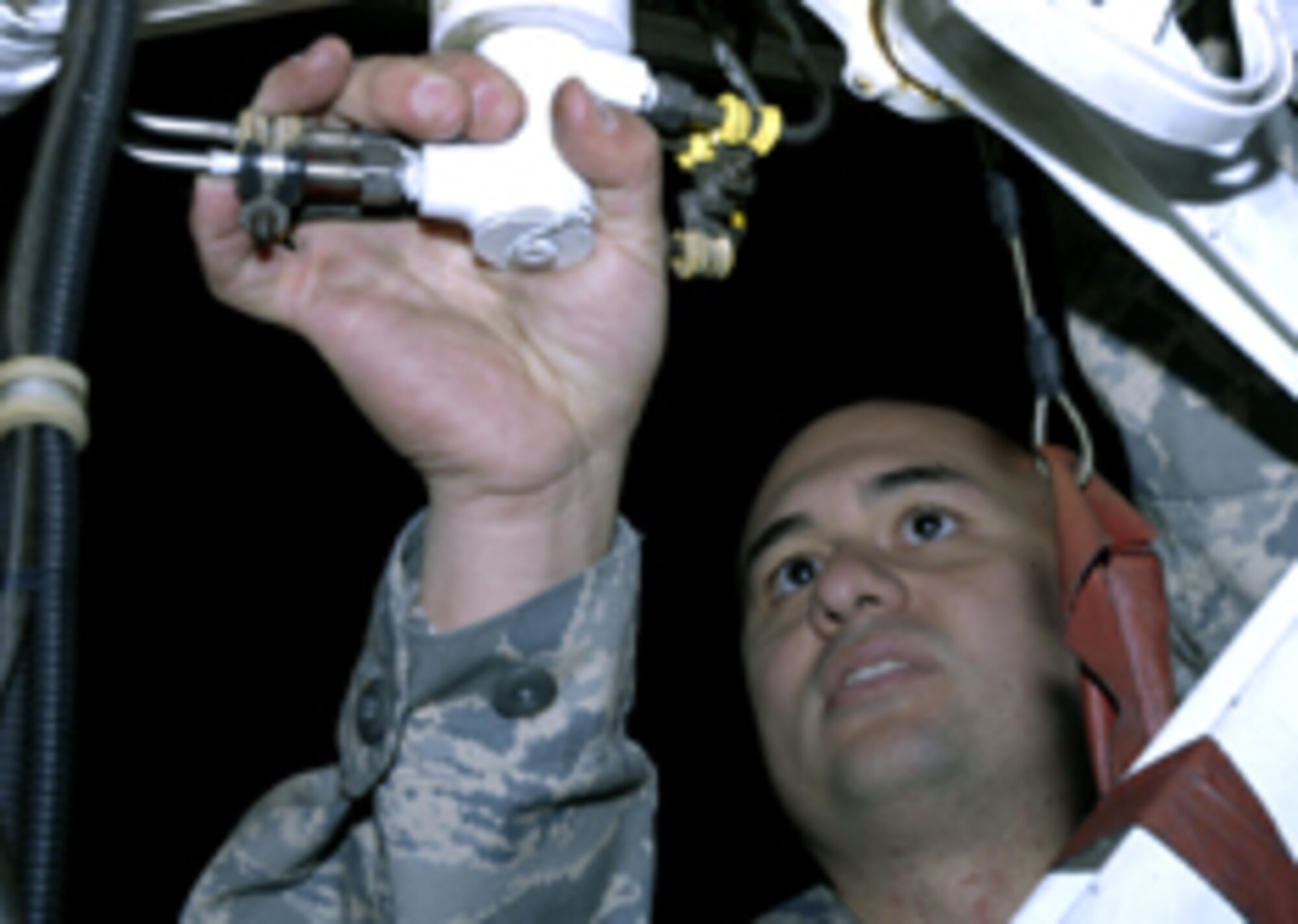 Senior Airman David Rodriguez, 48th Aircraft Maintenance Squadron, inspects the forward landing gear of an F-15 C Eagle Dec.19 at RAF Lakenheath. Maintainers are catching up on inspections for the aircraft while the 493rd Fighter Squadron is grounded due to possible structural failures to the fuselage of the F-15s. (U.S. Air Force photo by Airman Perry Aston) 