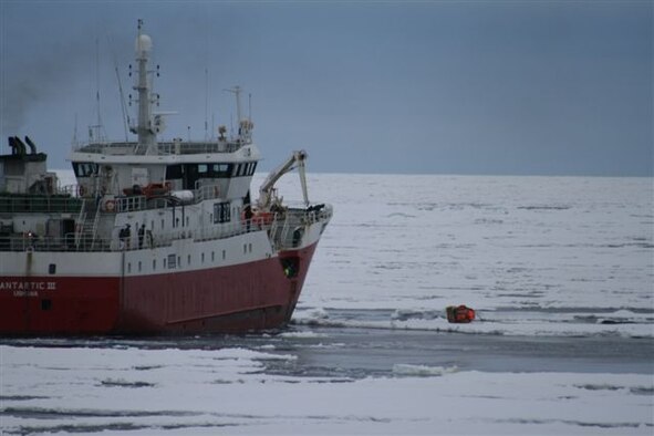 The crew of the stranded British fishing vessel, Argos Georgia, prepare to recover parts and supplies airdropped Jan. 4 by a C-17 Globemaster launched from Christchurch, New Zealand.  The Argos Georgia had suffered serious engine failure from negotiating ice while heading south in the Ross Sea, leaving it without propulsion and drifting with the ice.  The aircraft and the aircrews and support personnel from the 62nd Airlift Wing and 446th AW at McChord Air Force Base, Wash., are currently deployed to Christchurch to support the 13th Air Force-led Joint Task Force-Support Forces Antarctica, Operation Deep Freeze.  (Courtesy photo from Argos Georgia Limited.)