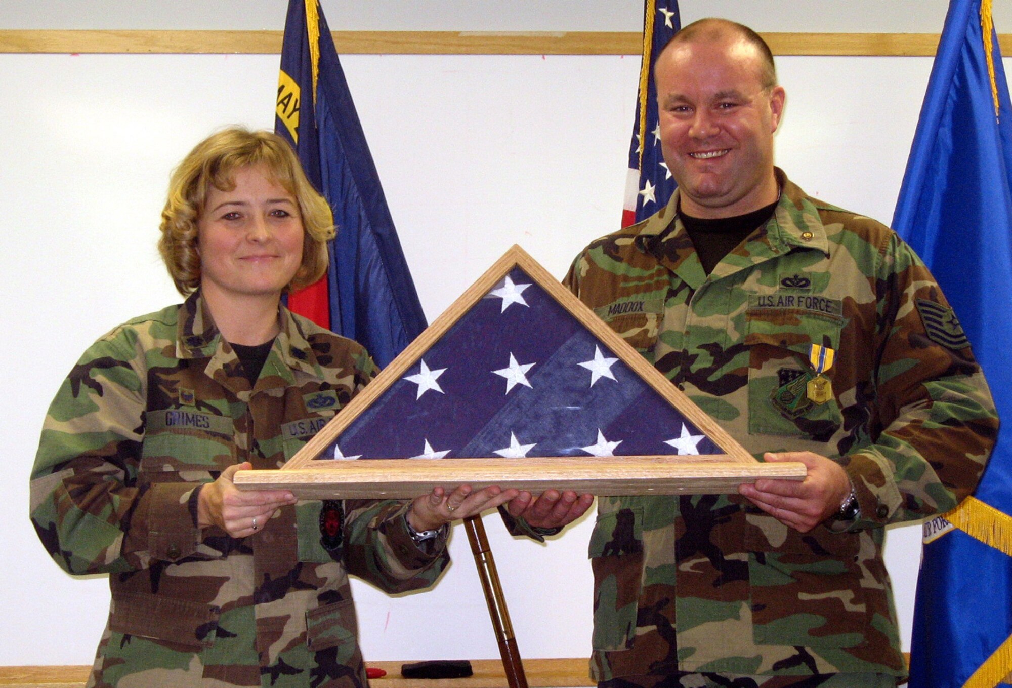 SEYMOUR JOHNSON AIR FORCE BASE, N.C.--Tech. Sgt. Dan Maddox, from the 916th Civil Engineer Squadron, received his retirement flag and flagbox during the 916th Air Refueling Wing's Unit Training Assembly here in December.
