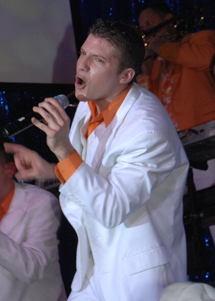 Senior Airman Jonathan Hayden, Tops In Blue vocalist, performs for service members and their families Jan. 3. Tops In Blue 2007 is a musical salute to the courageous men and women who serve in the U.S. Air Force. (U.S. Air Force photo/Senior Airman Sonya Padilla)