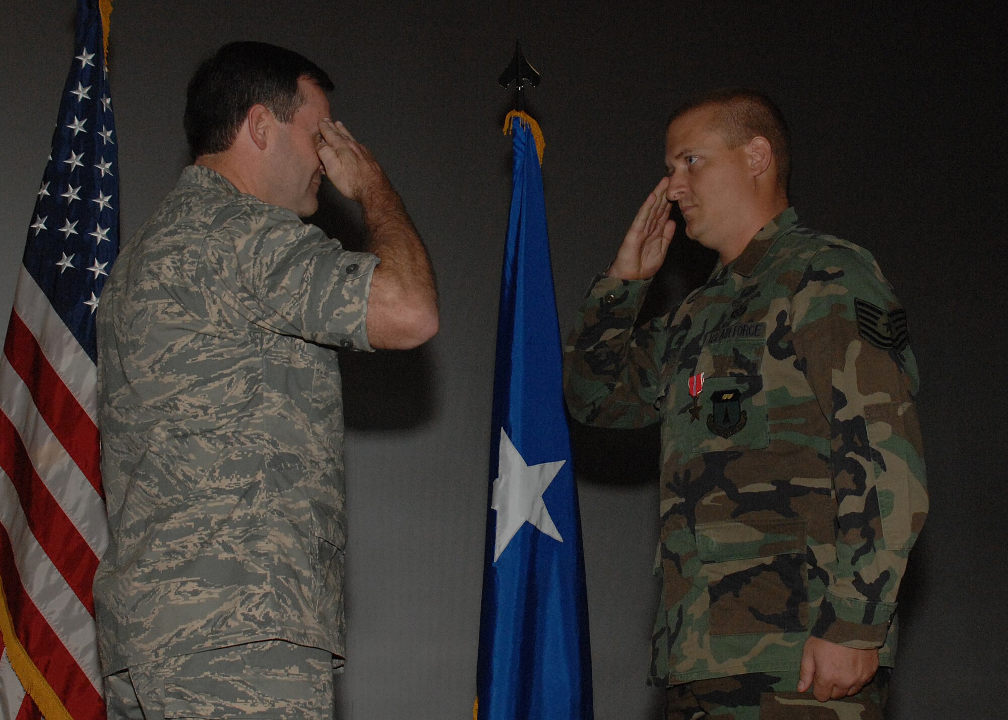 Staff Sgt. Ronald White, 36th Civil Engineer Squadron, salutes Brig. Gen. Douglas Owens, 36th Wing commander, after receiving the Bronze Star Medal Dec. 21 for performing outstanding service as an Explosive Ordnance Disposal team leader in the 332nd EOD Flight, Logistics Support Area Anaconda, from Jan. 7 to June 25, 2007 in support of Operation Iraqi Freedom. (U.S. Air Force photo/Senior Airman Sonya Padilla)