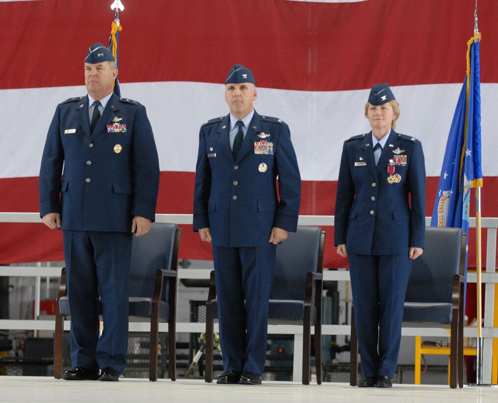 Maj. Gen. Robert Duignan, commander of 4th Air Force, presided over the change of command January 6 at the 932nd Airlift Wing.  Col. John (Jay) C. Flournoy, Jr., (center) took the reigns of the Air Force Reserve Command unit from Col. Maryanne Miller.  Photo/Tech Sgt. Chris Parr