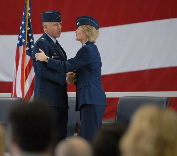 Incoming commander, Colonel John (Jay) C. Flournoy, Jr., says farewell to Colonel Maryanne Miller at his change of command ceremony for the 932nd Airlift Wing.  Photo/Tech Sgt. Gerald Sonnenberg