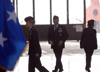 932nd Airlift Wing outgoing commander Col. Maryanne Miller walks to the stage, followed by new commander Colonel John (Jay) C. Flournoy, Jr.  Photo/Tech Sgt. Dan Oliver
